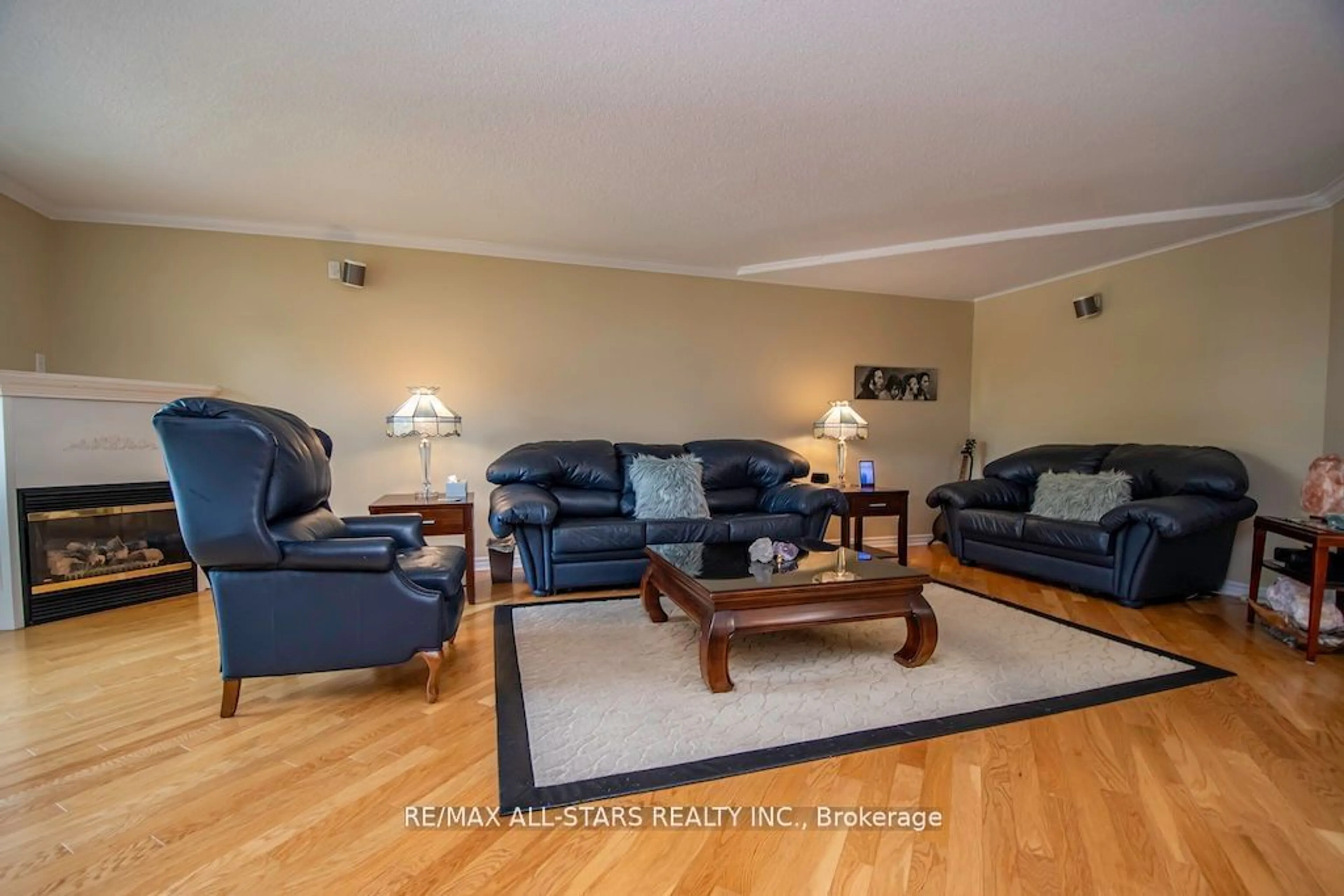 Living room with furniture, wood/laminate floor for 51 Rivermill Blvd #305, Kawartha Lakes Ontario K9V 6E8