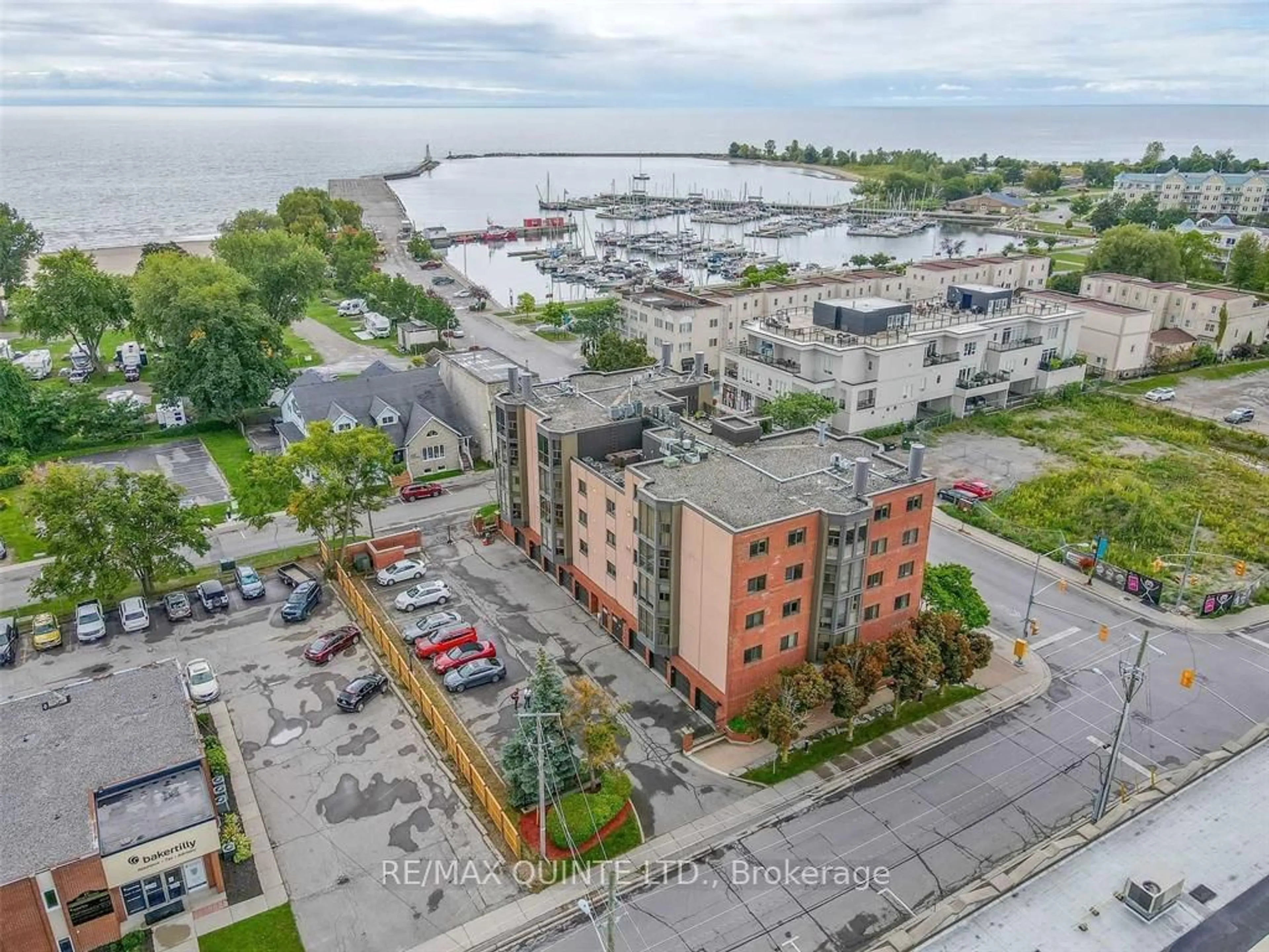 A pic from outside/outdoor area/front of a property/back of a property/a pic from drone, water/lake/river/ocean view for 1 Queen St #401, Cobourg Ontario K9A 1M8