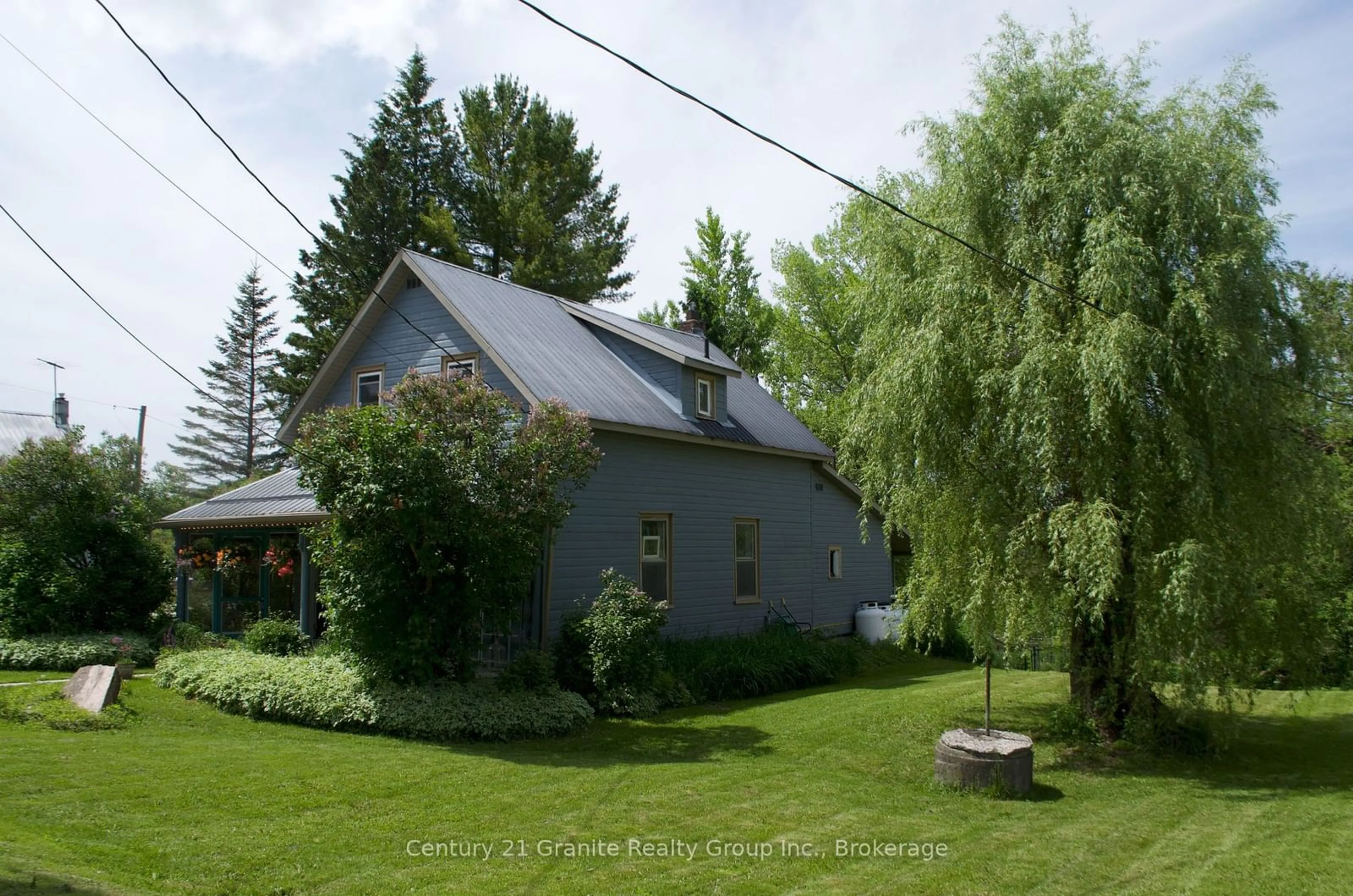 A pic from outside/outdoor area/front of a property/back of a property/a pic from drone, street for 15 Newcastle St, Minden Hills Ontario K0M 2A0