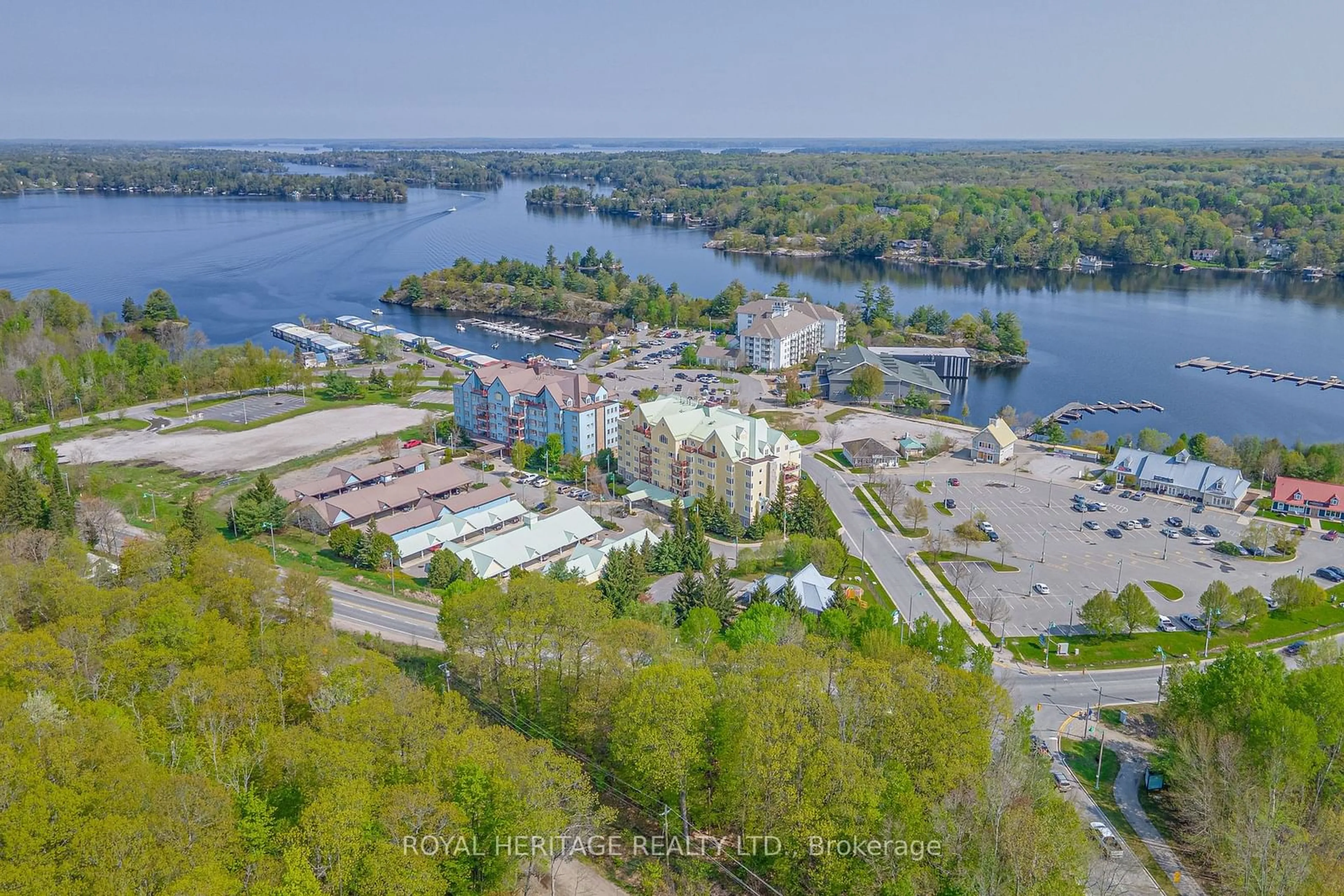 A pic from outside/outdoor area/front of a property/back of a property/a pic from drone, water/lake/river/ocean view for 130 Steamship Bay Rd #605, Gravenhurst Ontario P0C 1G0