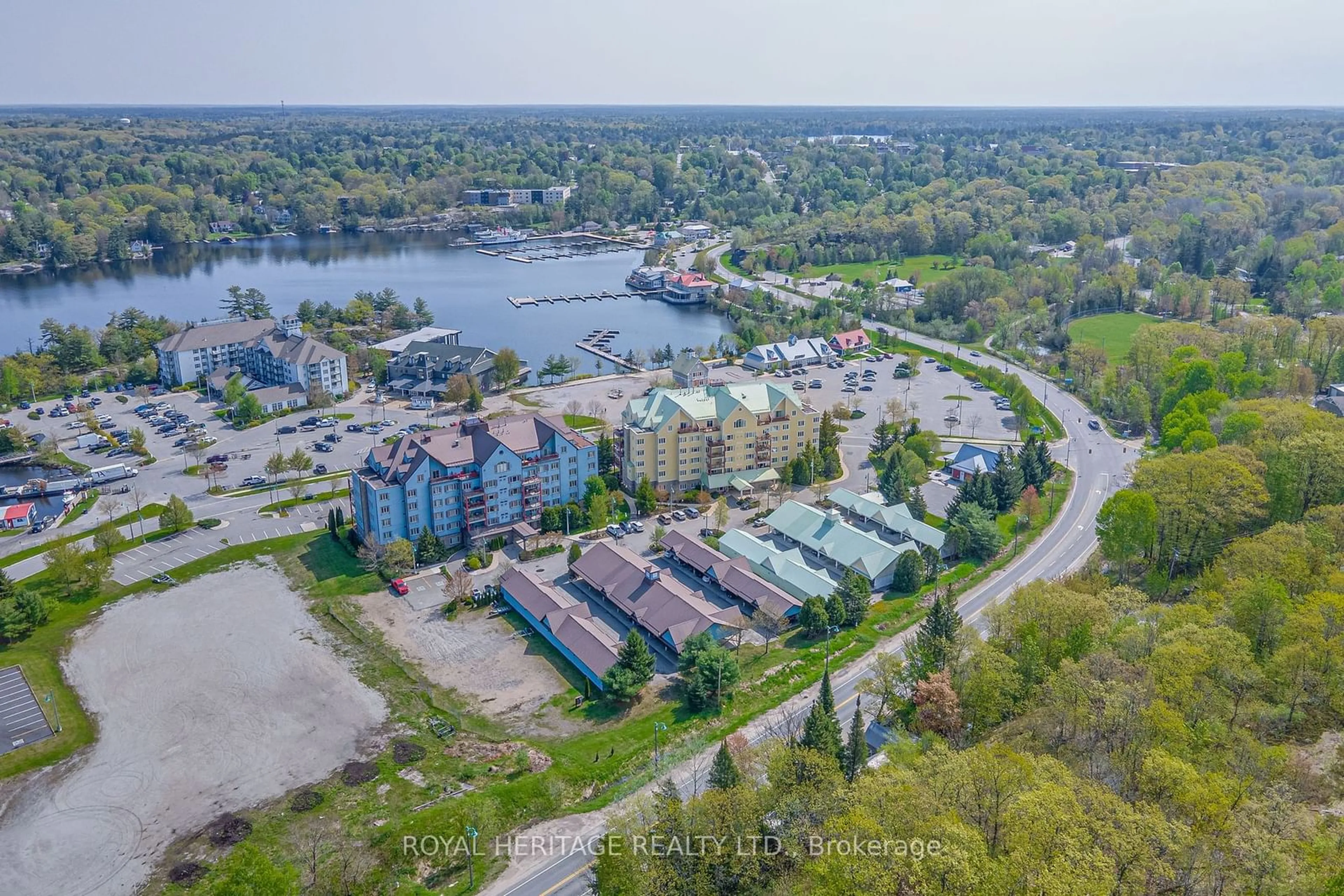 A pic from outside/outdoor area/front of a property/back of a property/a pic from drone, water/lake/river/ocean view for 130 Steamship Bay Rd #605, Gravenhurst Ontario P0C 1G0