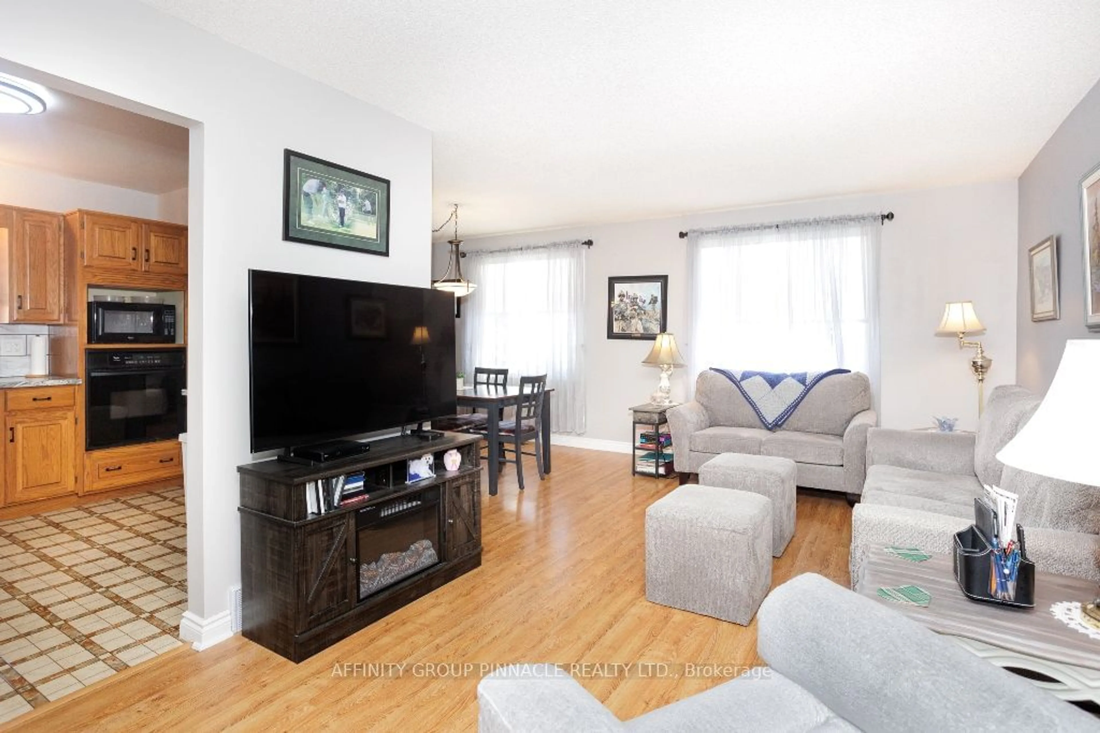 Living room with furniture, wood/laminate floor for 294 Mary St, Kawartha Lakes Ontario K9V 5S7