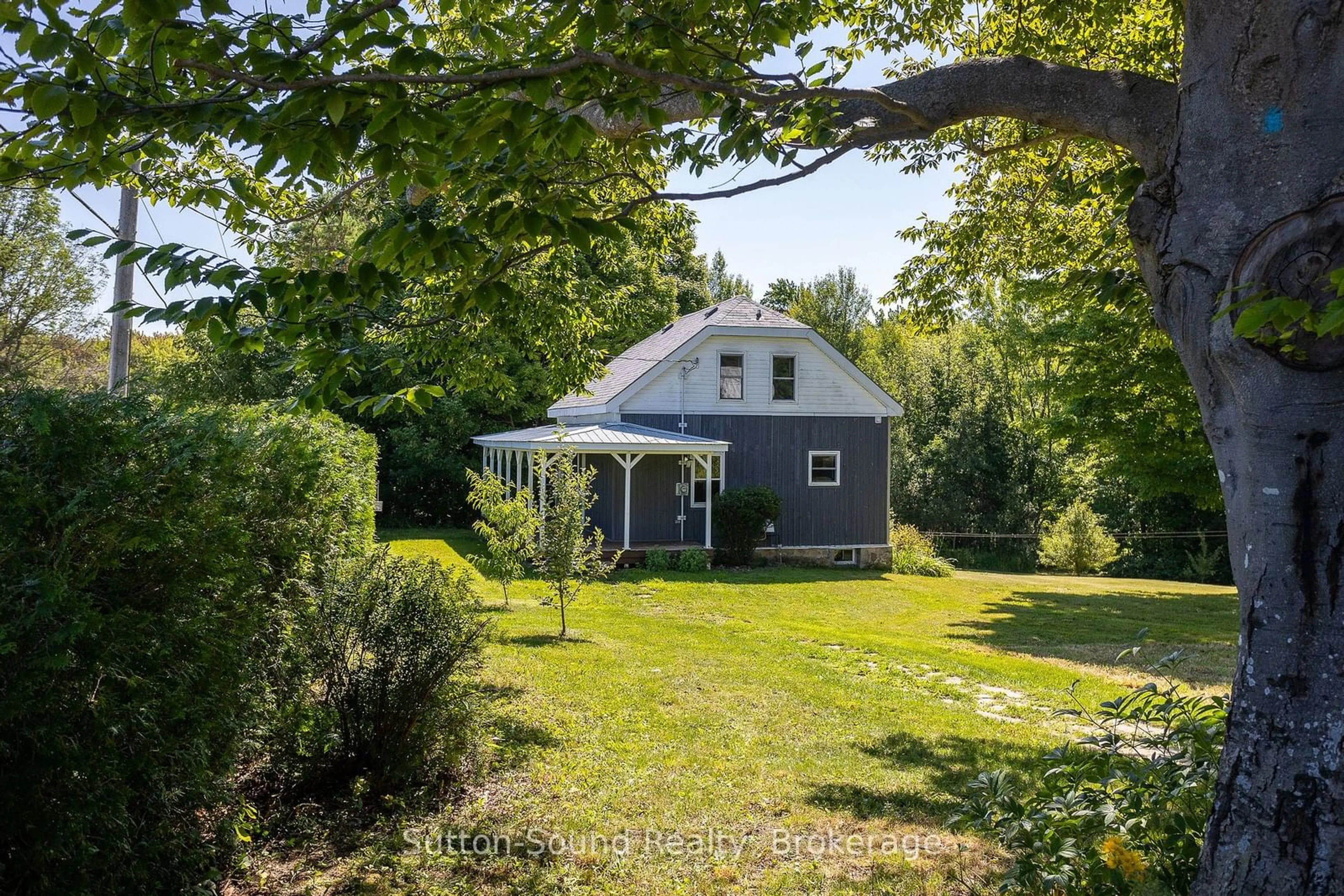 A pic from outside/outdoor area/front of a property/back of a property/a pic from drone, street for 361232 Concession 16, Georgian Bluffs Ontario N0H 2T0