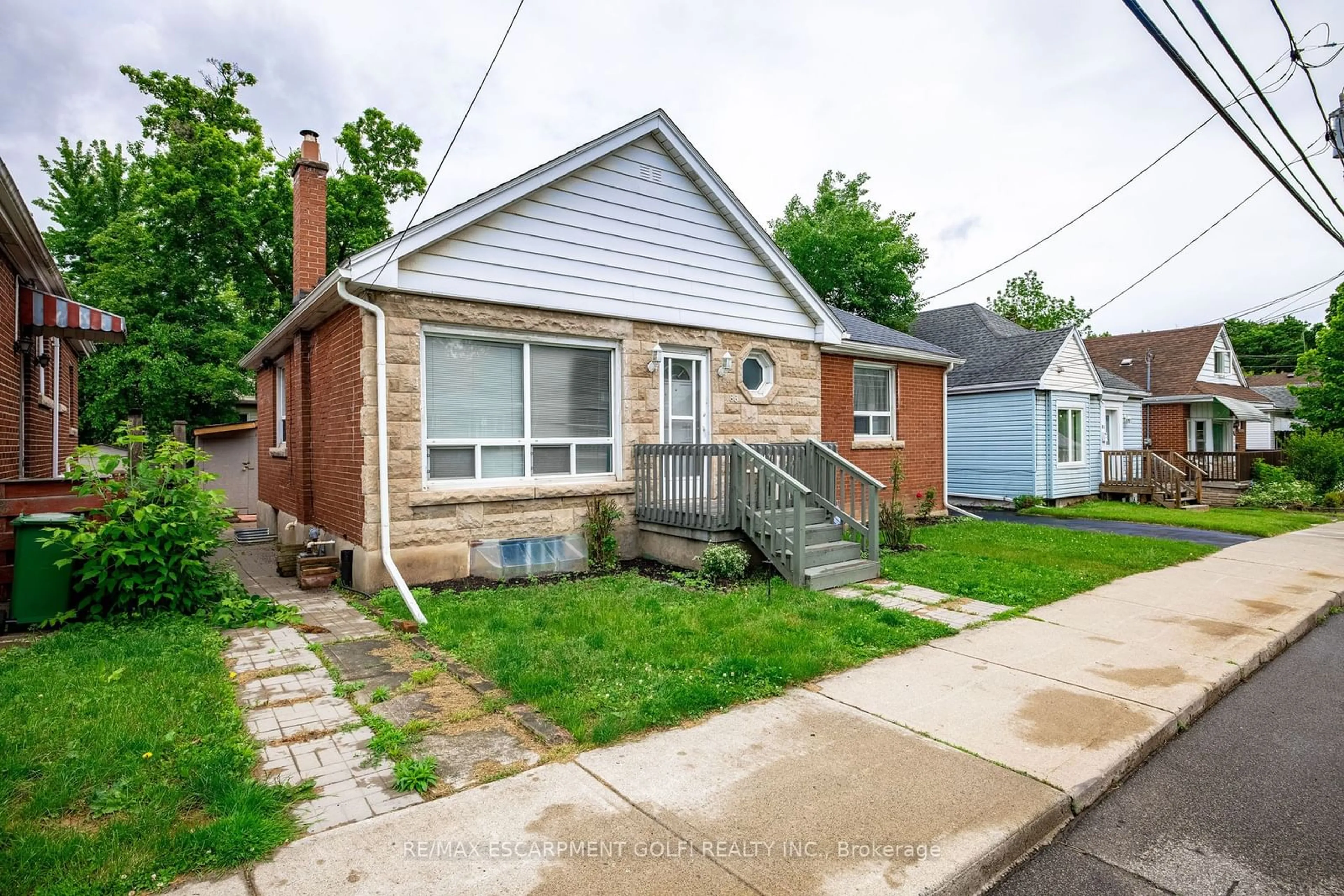 Home with brick exterior material, street for 86 Whitney Ave, Hamilton Ontario L8S 2G5