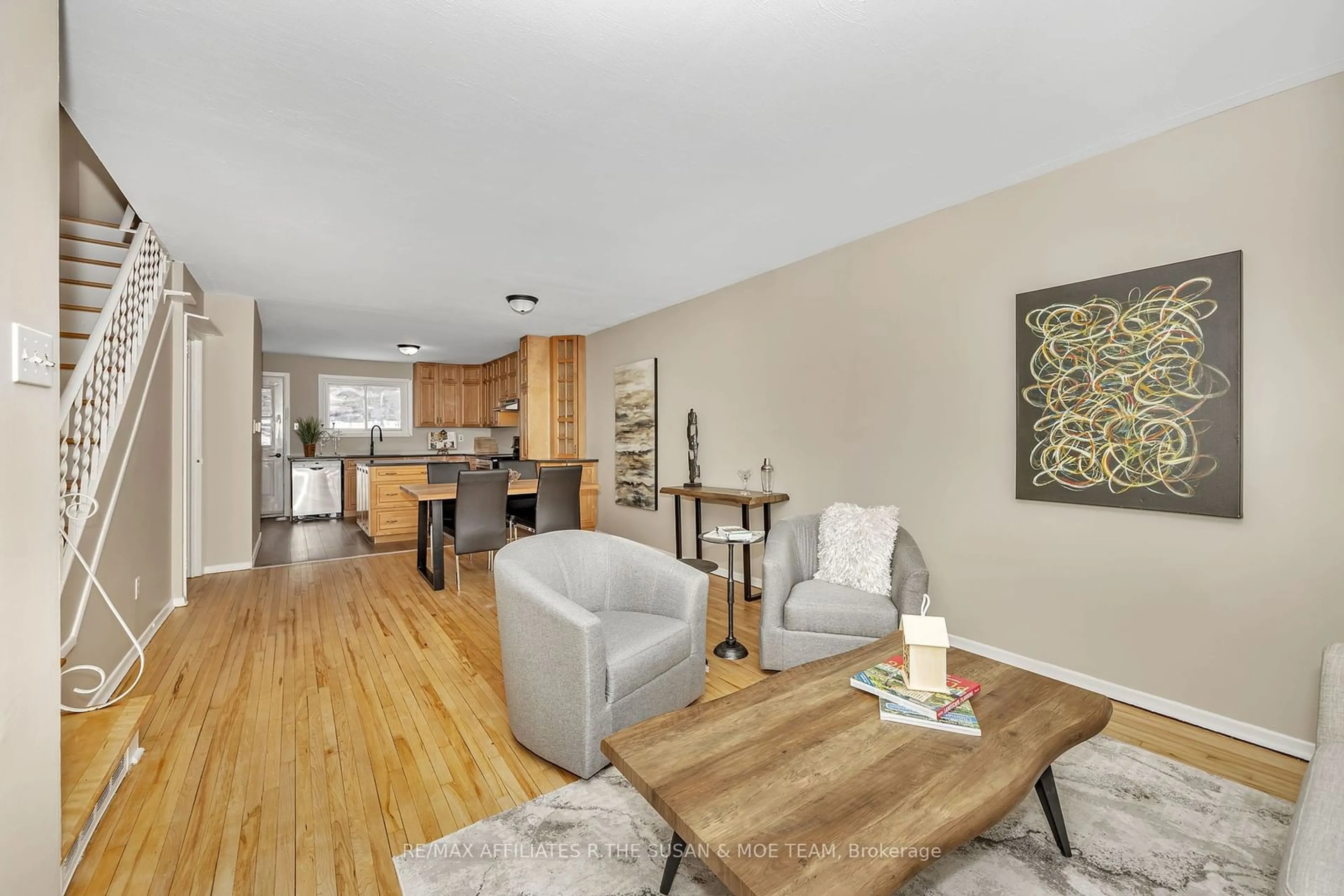 Living room with furniture, wood/laminate floor for 1508 Lepage Ave, Carlington - Central Park Ontario K1Z 8C9