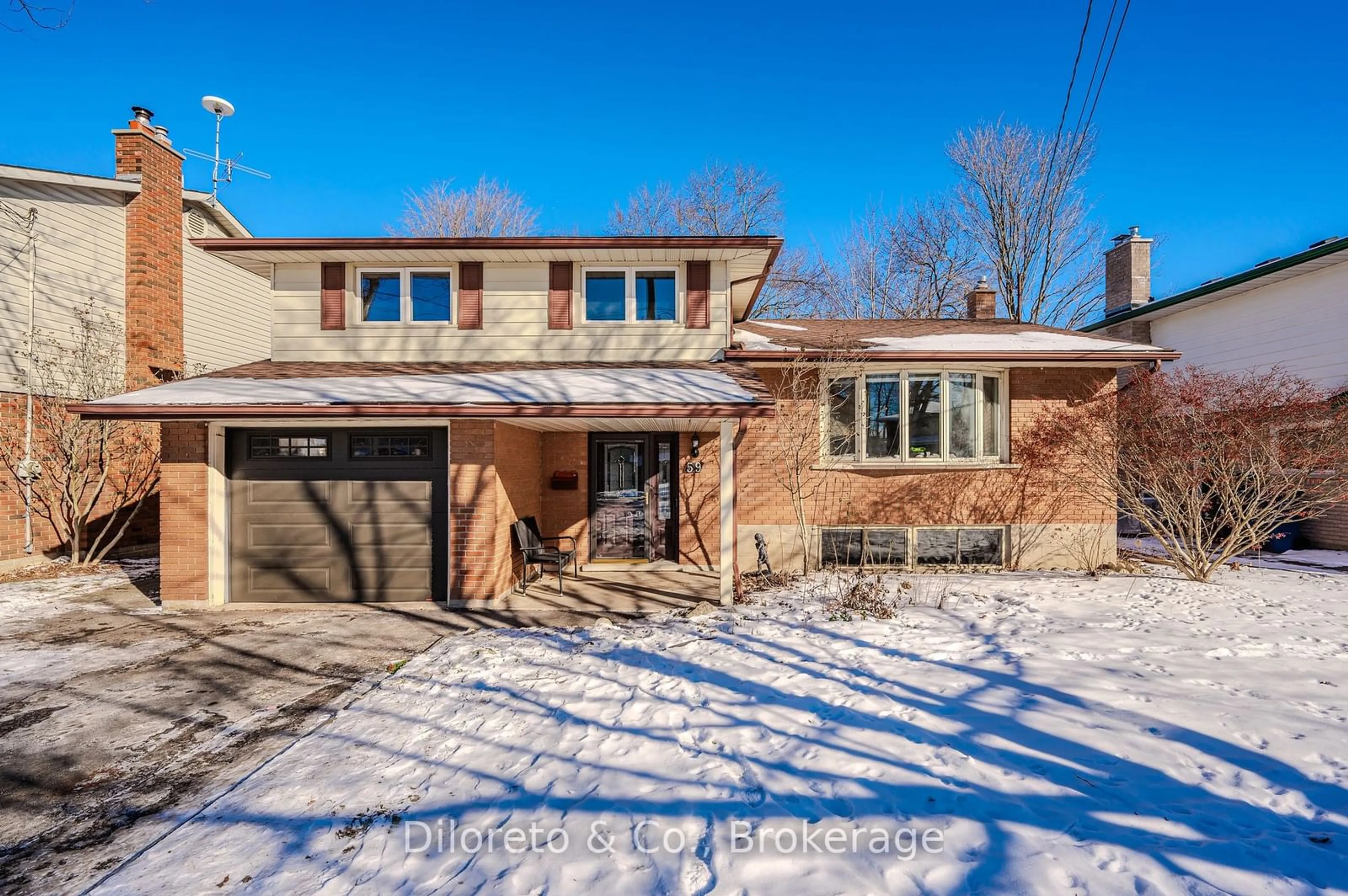 Home with brick exterior material, street for 59 Elginfield Dr, Guelph Ontario N1E 4E5