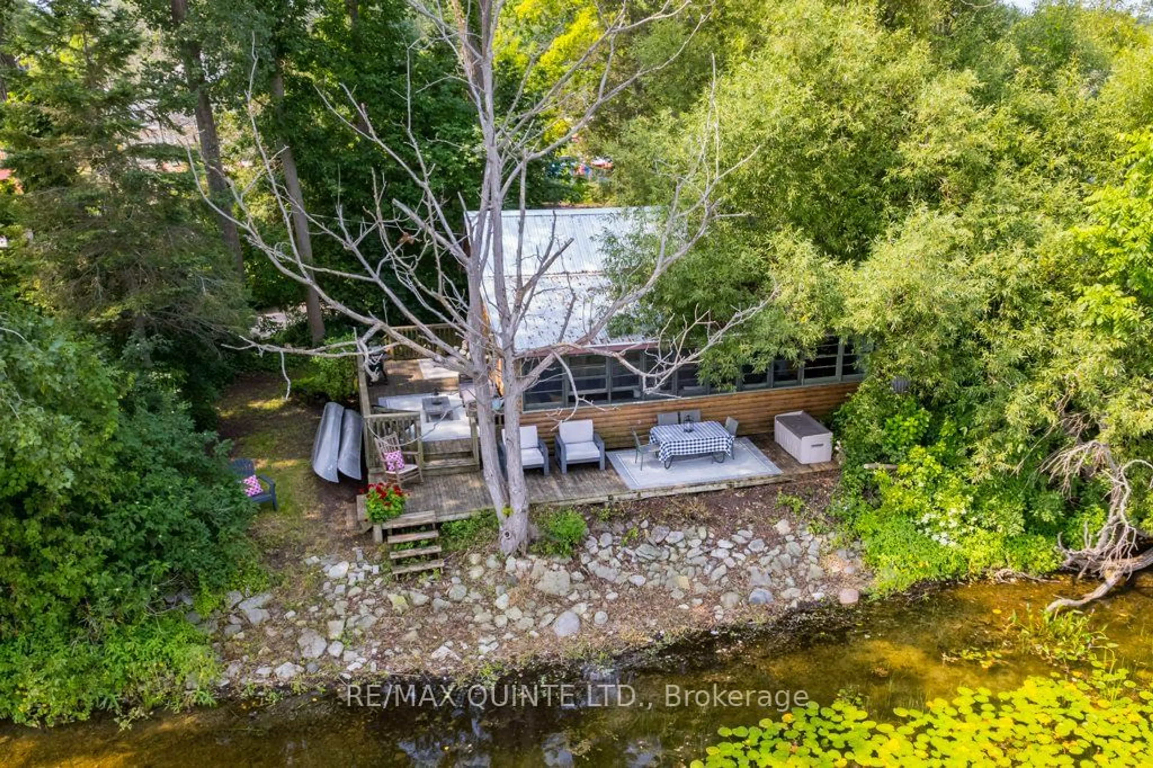 A pic from outside/outdoor area/front of a property/back of a property/a pic from drone, water/lake/river/ocean view for 142 Outlet Rd, Prince Edward County Ontario K0K 1P0