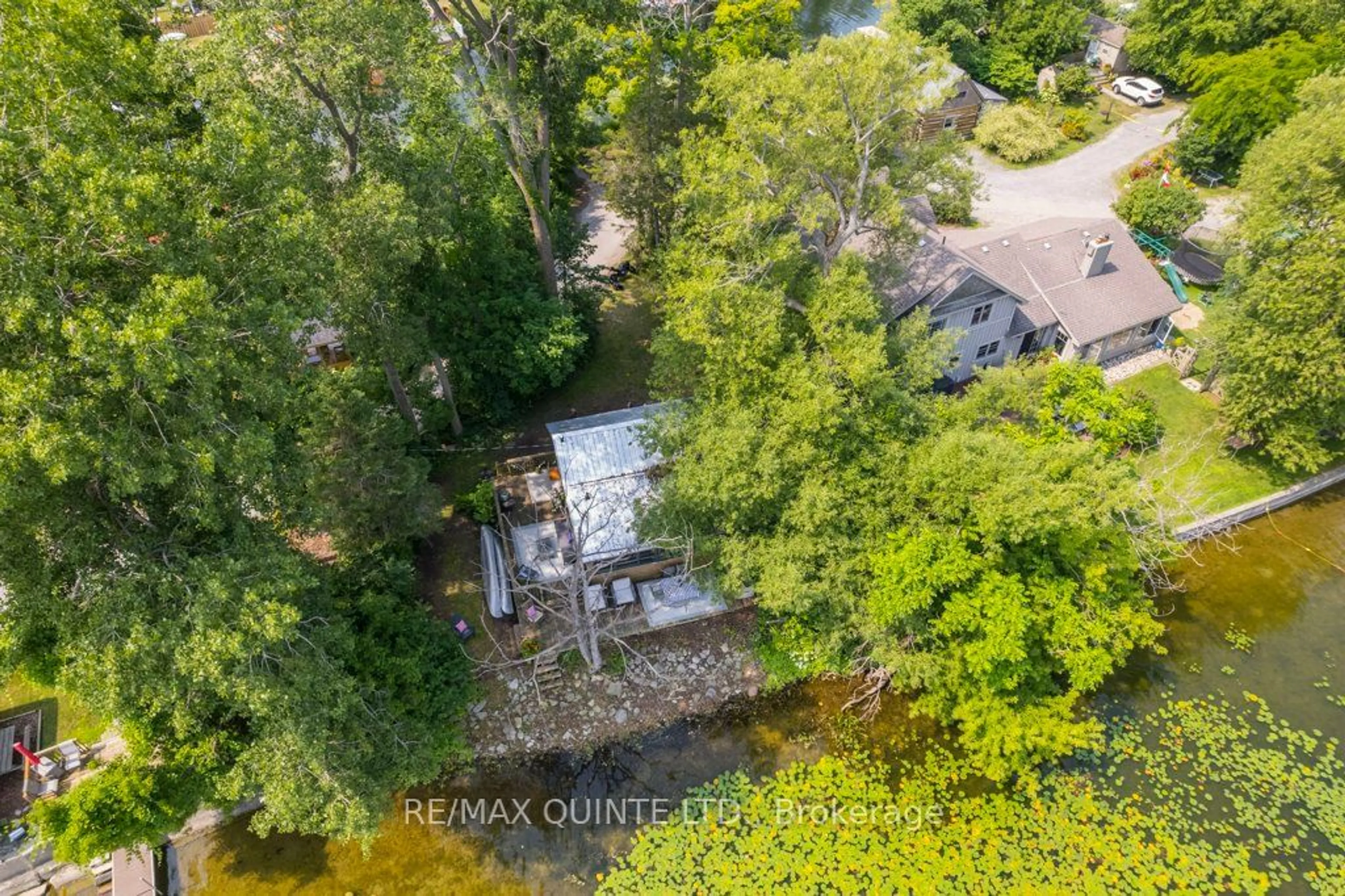 A pic from outside/outdoor area/front of a property/back of a property/a pic from drone, water/lake/river/ocean view for 142 Outlet Rd, Prince Edward County Ontario K0K 1P0