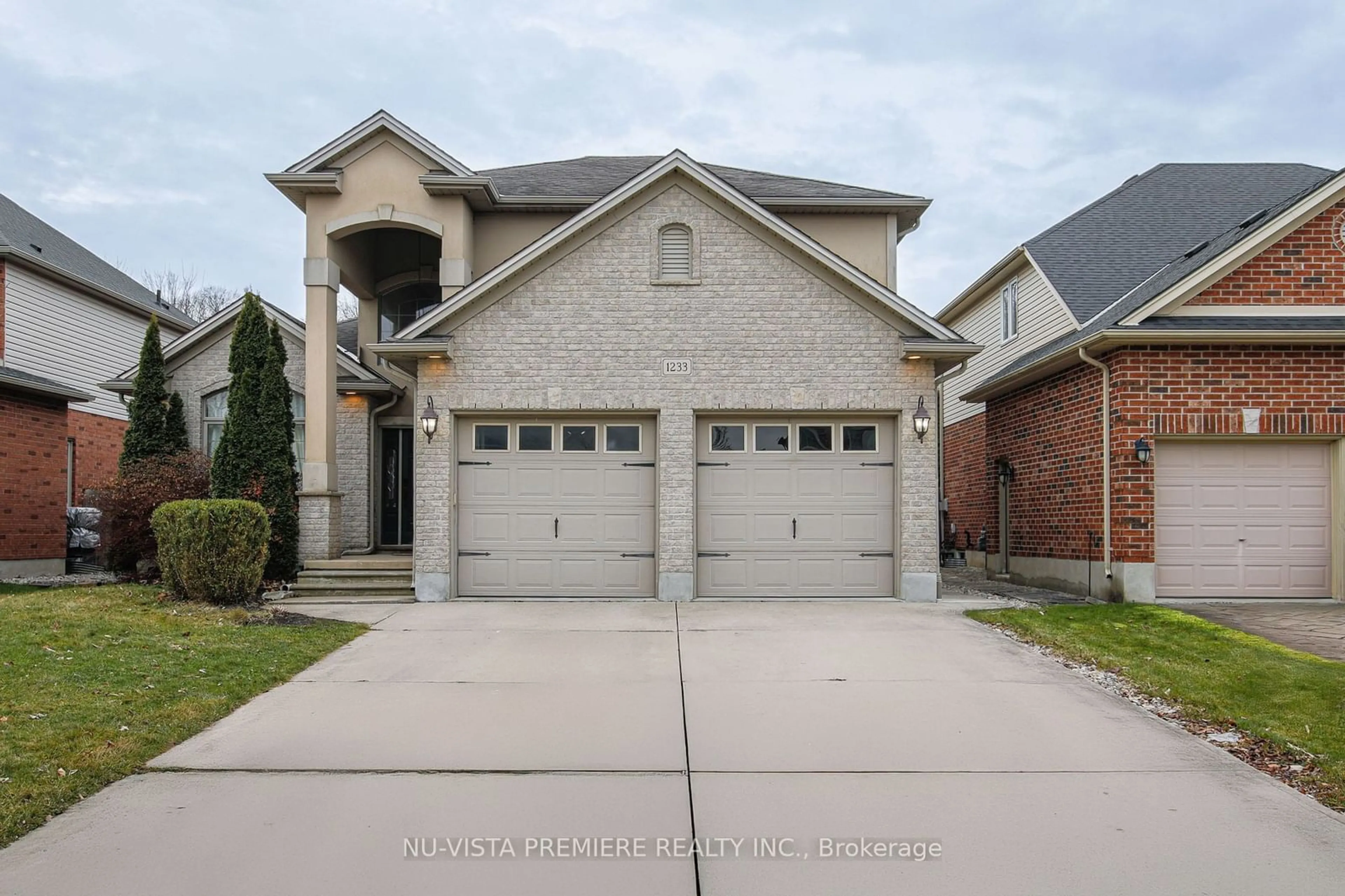 Home with brick exterior material, street for 1233 Thamesridge Cres, London Ontario N6K 4Z6