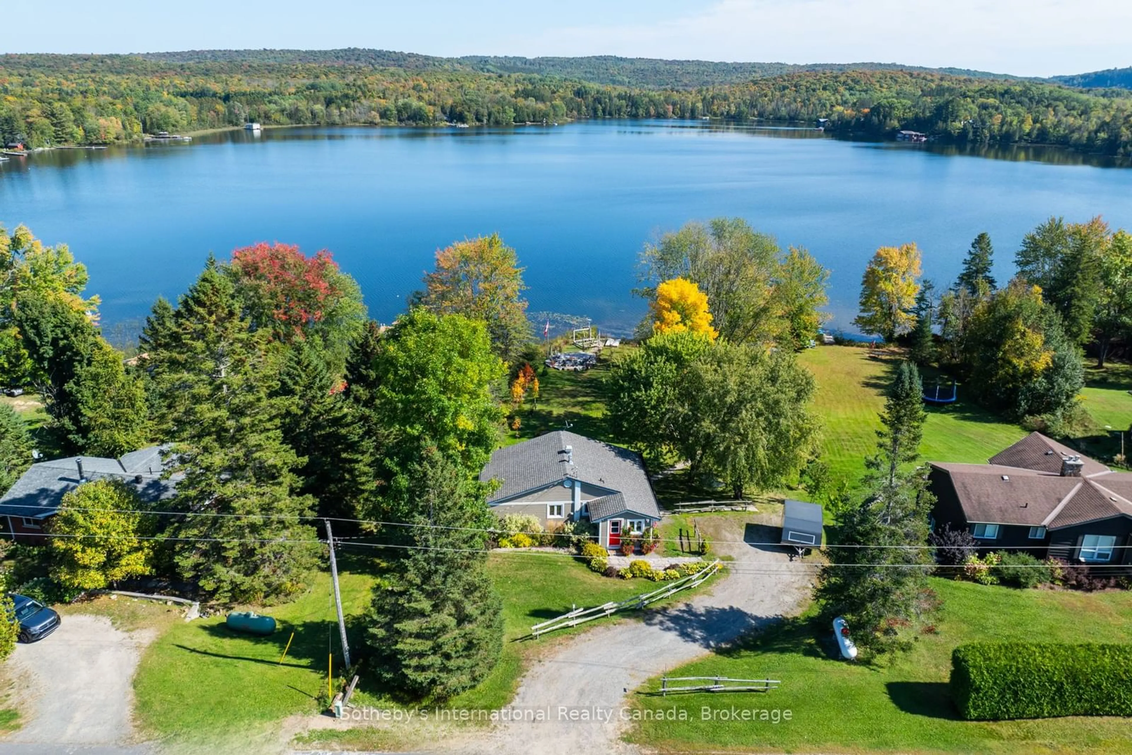 A pic from outside/outdoor area/front of a property/back of a property/a pic from drone, water/lake/river/ocean view for 1111 Maplehurst Dr, Lake of Bays Ontario P1H 2J6