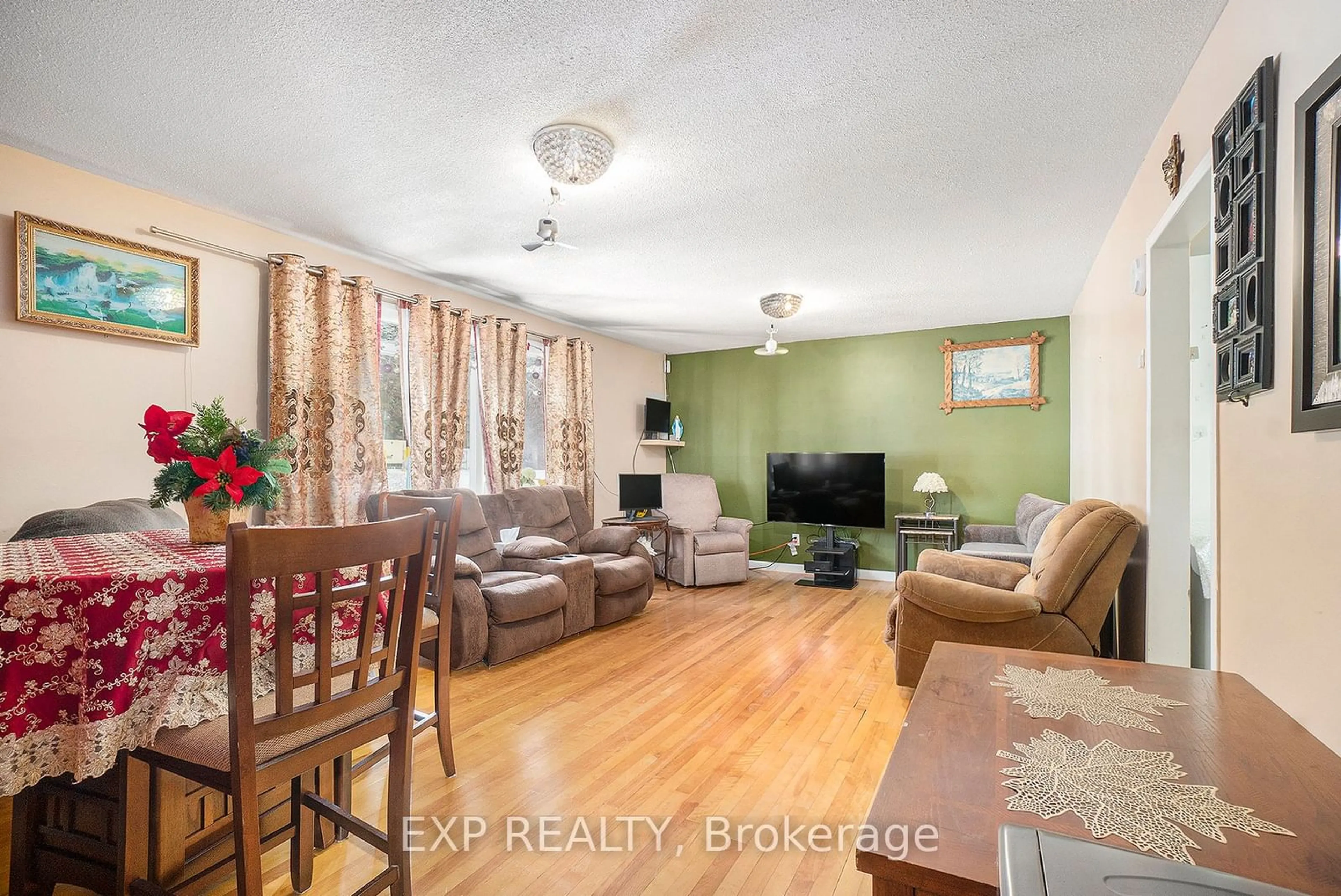 Living room with furniture, wood/laminate floor for 2024 Othello Ave, Elmvale Acres and Area Ontario K1G 2A6