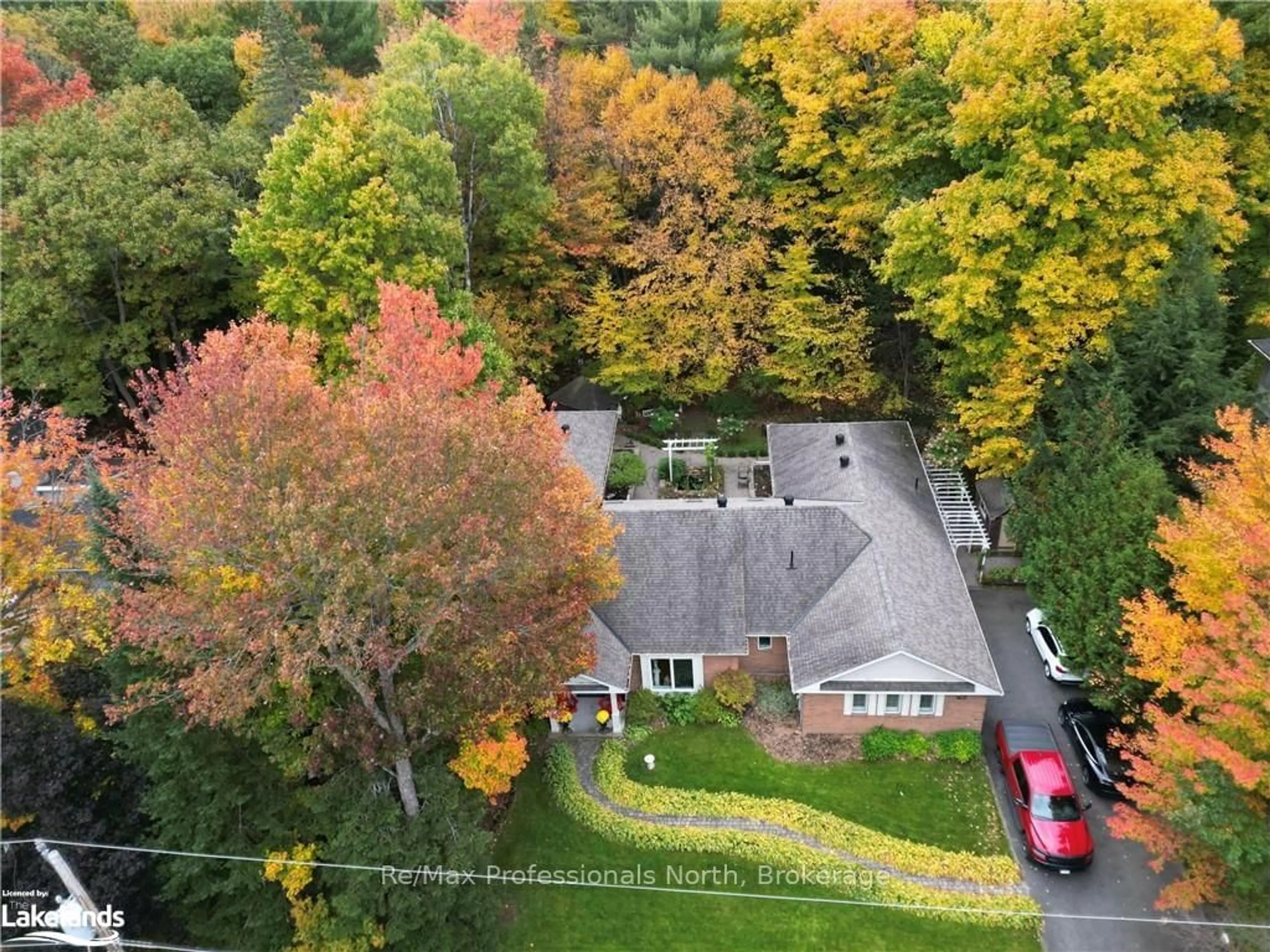 A pic from outside/outdoor area/front of a property/back of a property/a pic from drone, forest/trees view for 21 BRIAN Rd, Bracebridge Ontario P1L 1A5