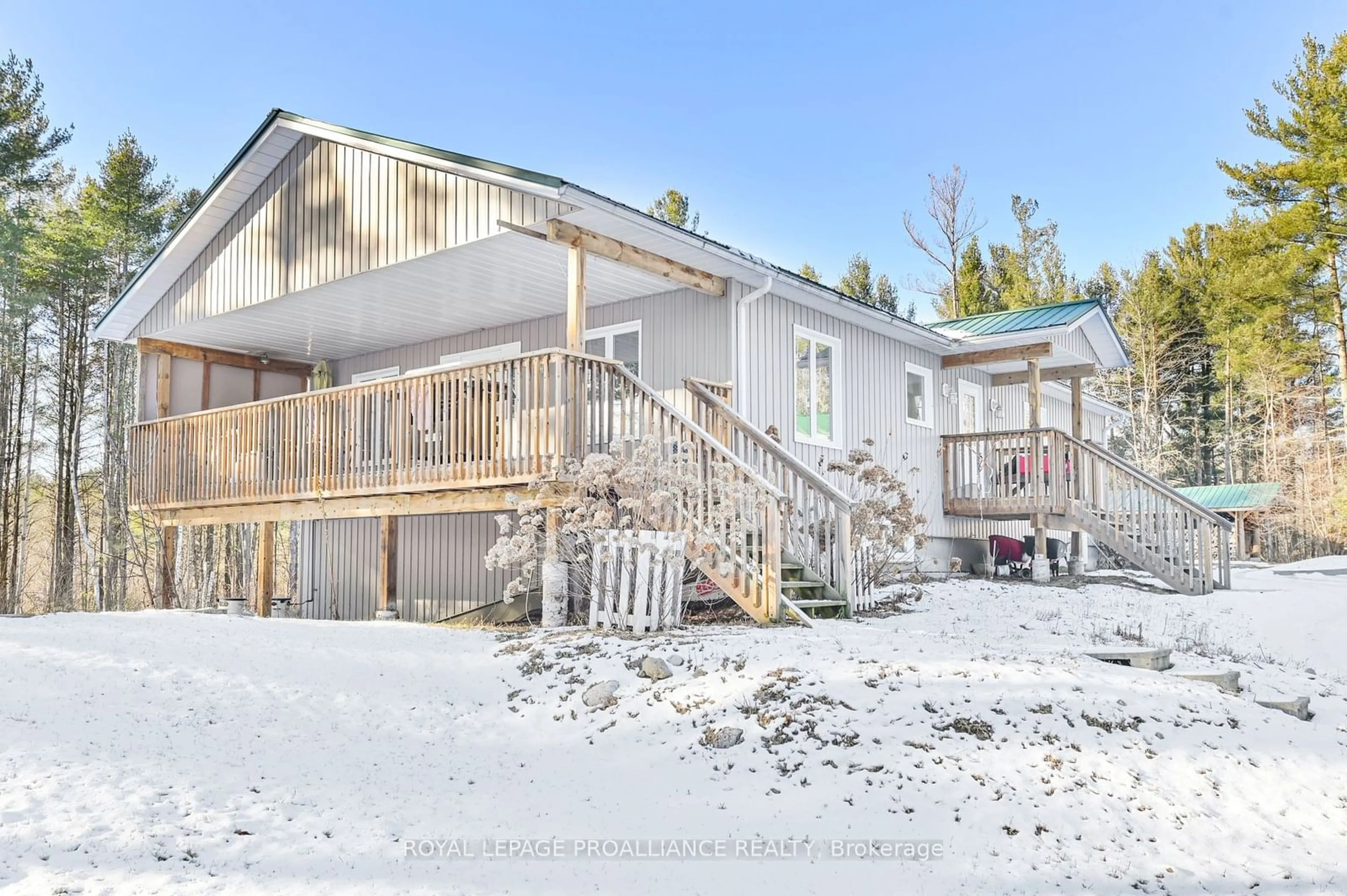A pic from outside/outdoor area/front of a property/back of a property/a pic from drone, mountain view for 112 Moores Rd, Tweed Ontario K0K 3J0