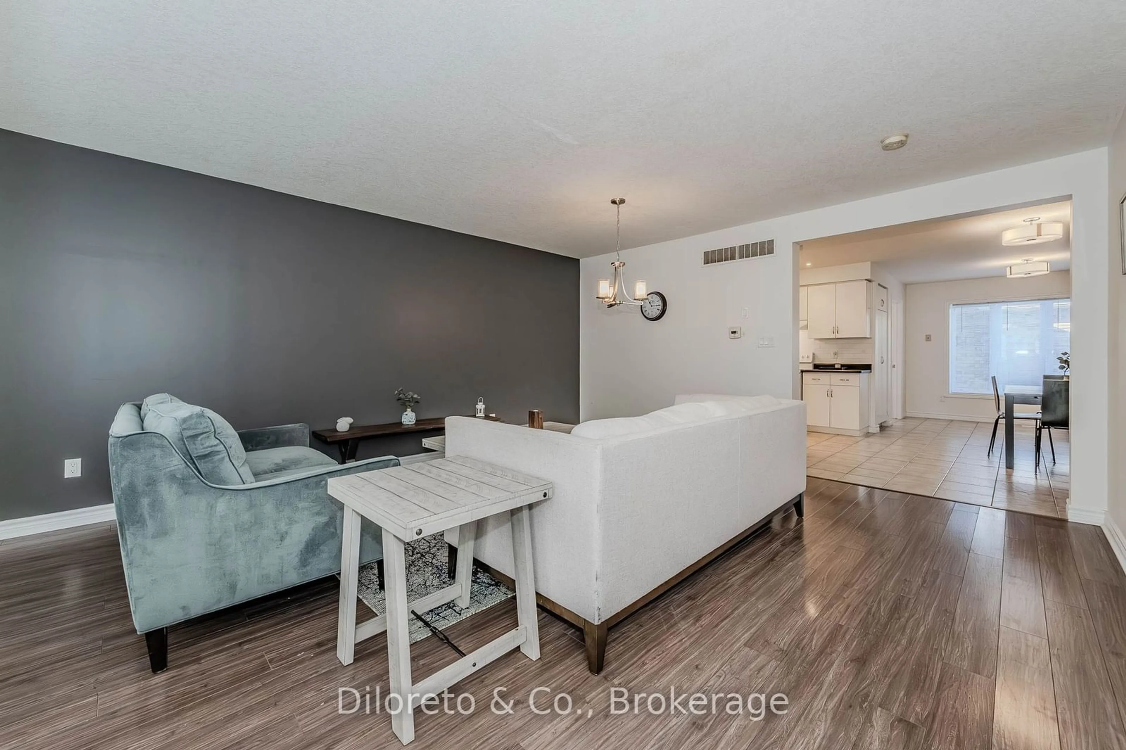 Living room with furniture, wood/laminate floor for 20 SHACKLETON Dr #46, Guelph Ontario N1E 0C5