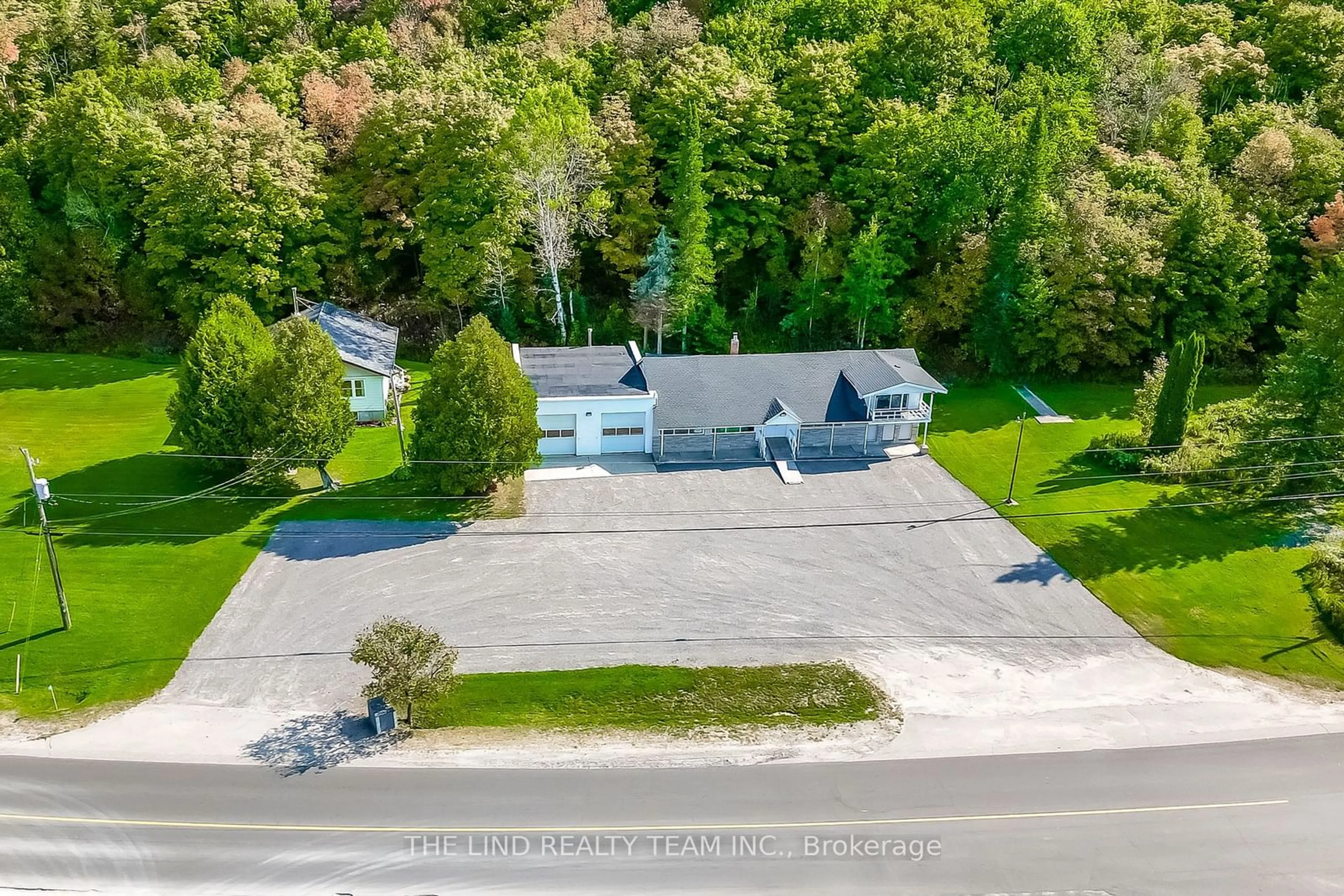 A pic from outside/outdoor area/front of a property/back of a property/a pic from drone, street for 949 Raymond Rd, Muskoka Lakes Ontario P0B 1M0