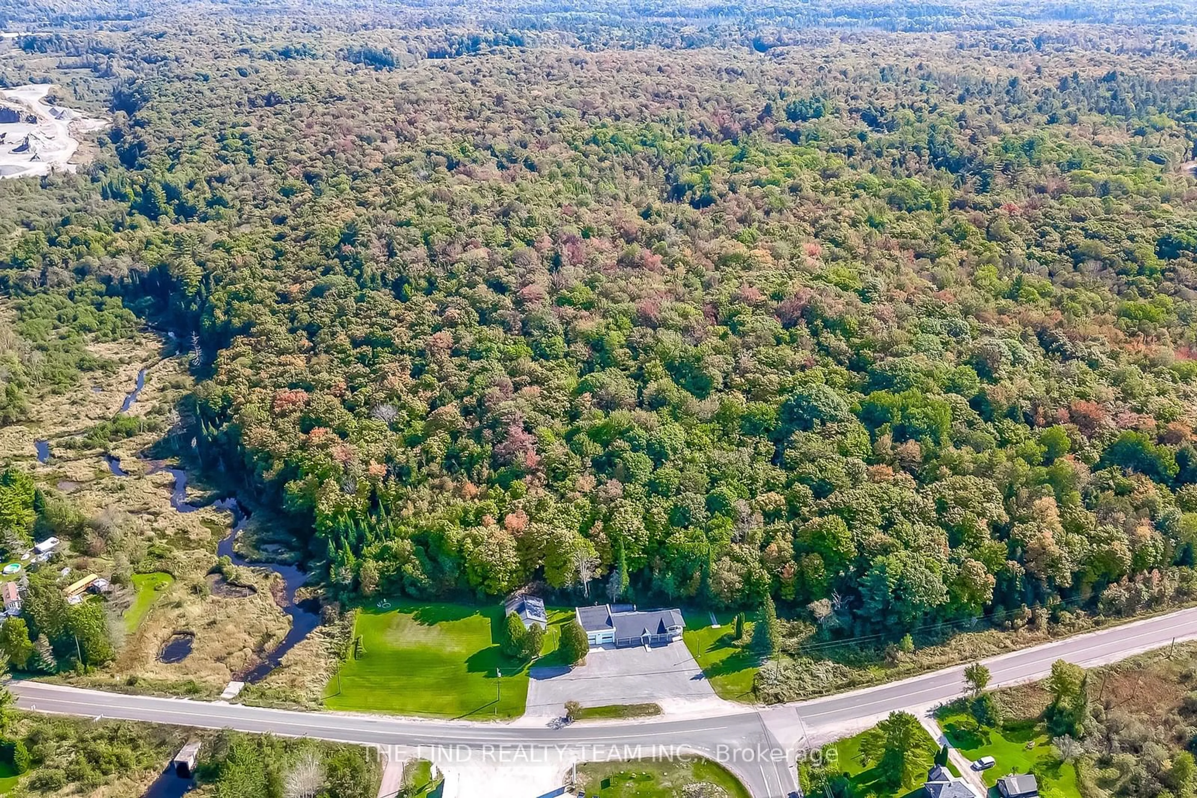 A pic from outside/outdoor area/front of a property/back of a property/a pic from drone, forest/trees view for 949 Raymond Rd, Muskoka Lakes Ontario P0B 1M0