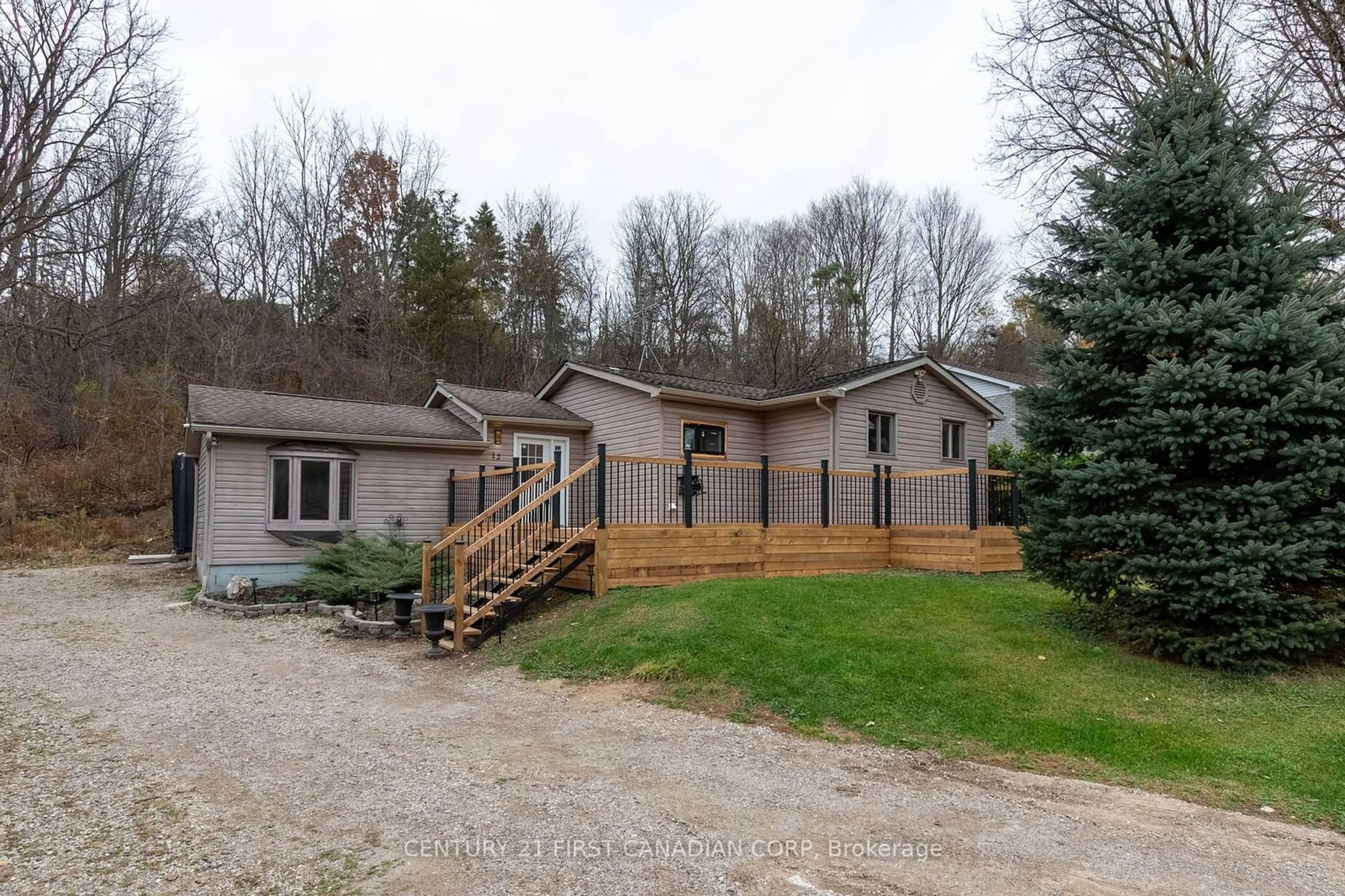 A pic from outside/outdoor area/front of a property/back of a property/a pic from drone, mountain view for 12 Davis St, Central Elgin Ontario N5P 1X8