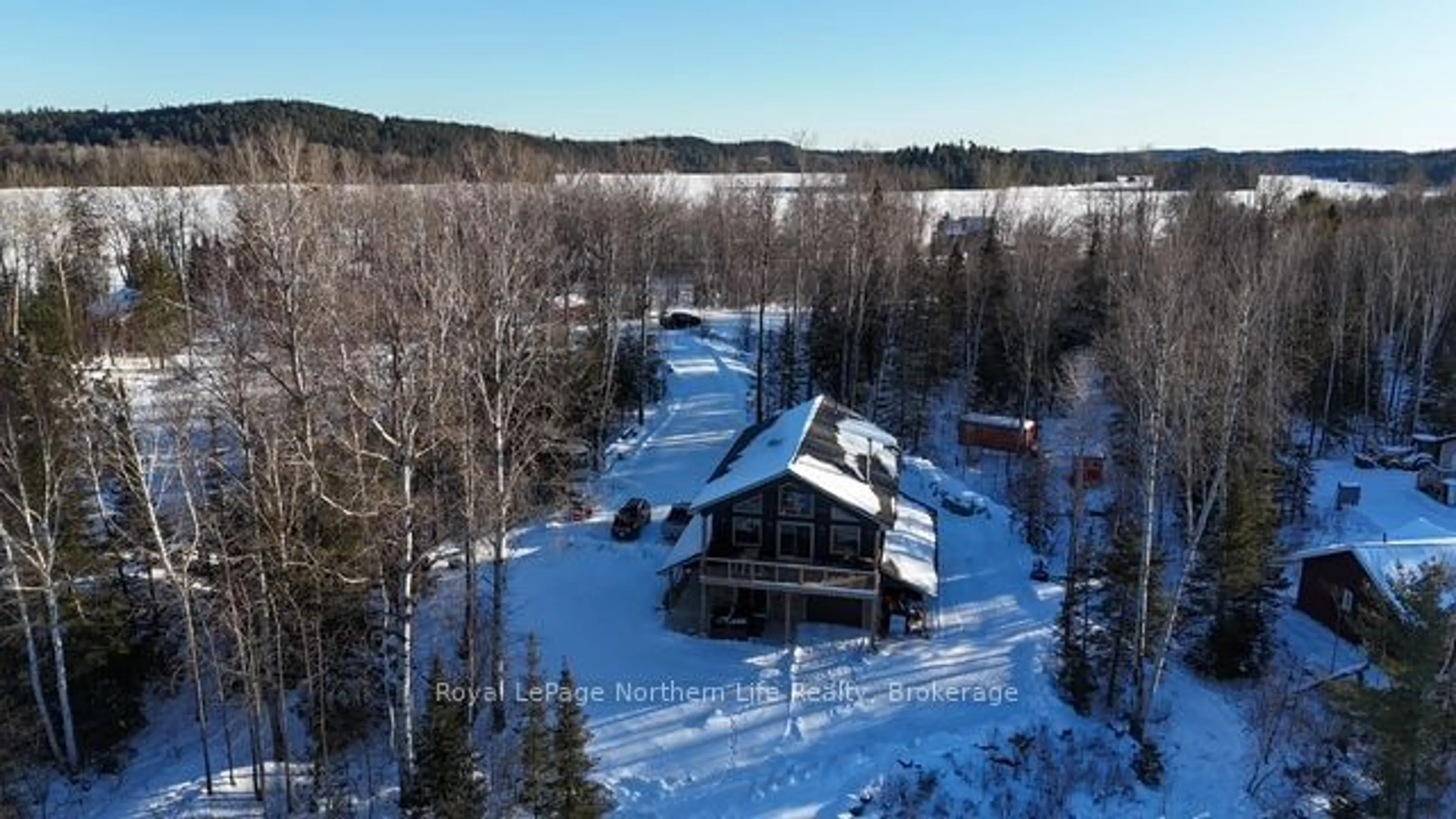 A pic from outside/outdoor area/front of a property/back of a property/a pic from drone, unknown for 56 WHITE BEAR Crt, Temagami Ontario P0H 2H0