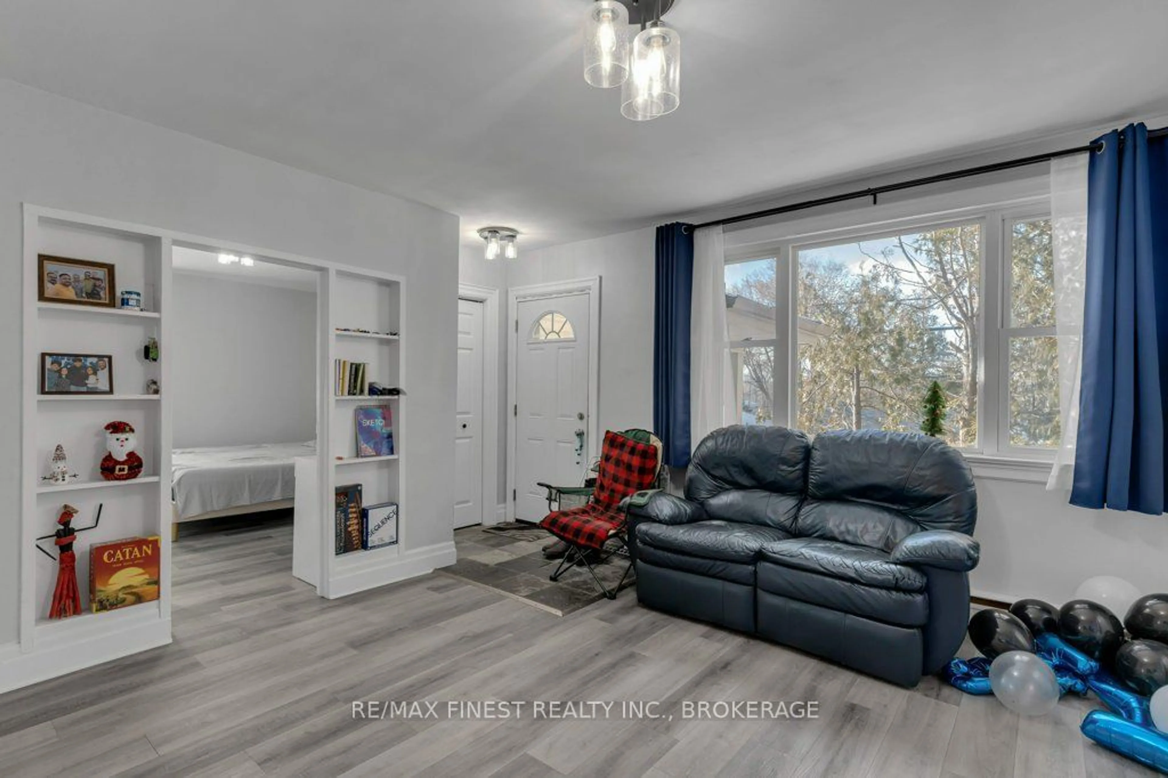 Living room with furniture, wood/laminate floor for 789 Portsmouth Ave, Kingston Ontario K7M 1W6