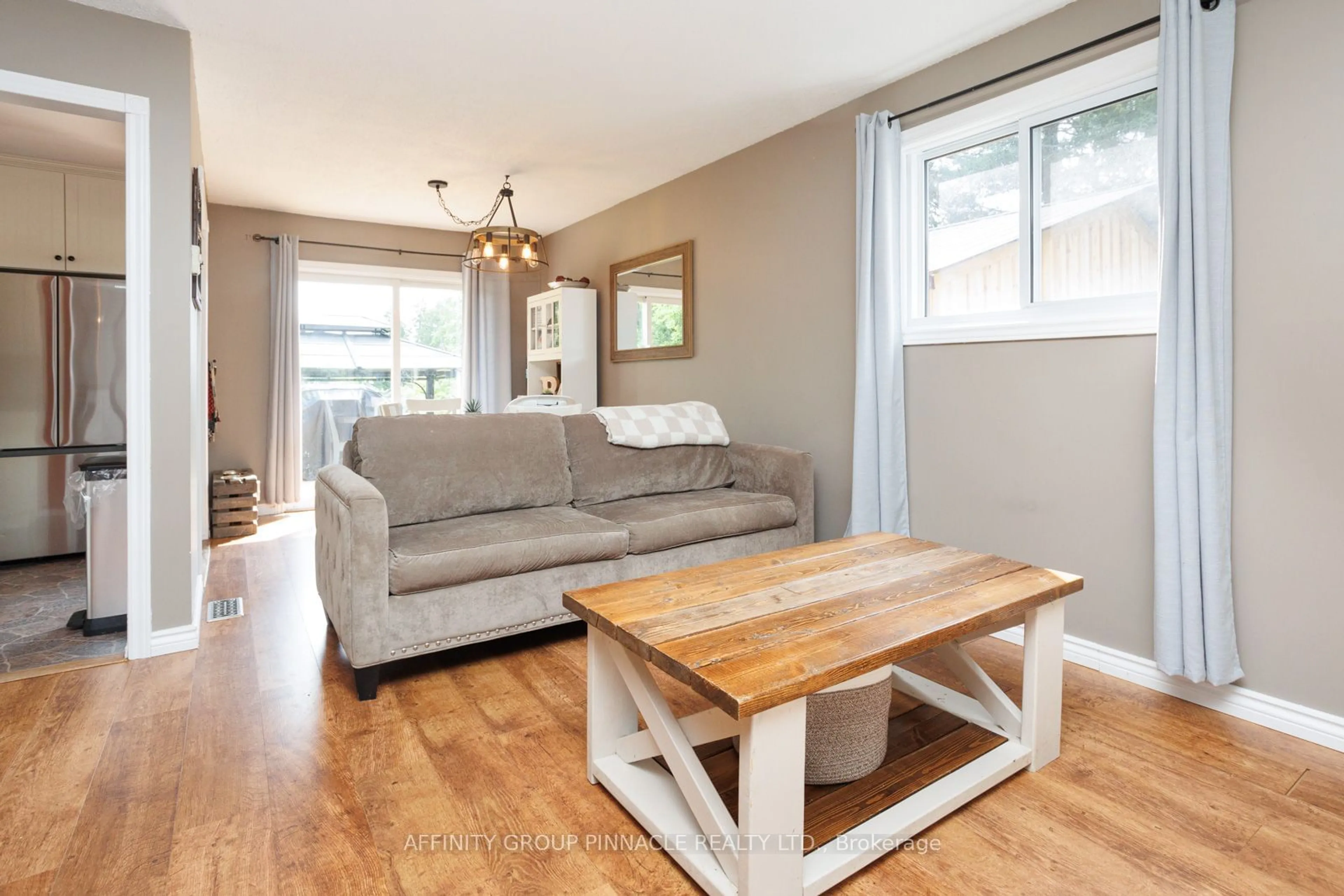 Living room with furniture, wood/laminate floor for 71 Goodman Rd, Kawartha Lakes Ontario K0M 1N0