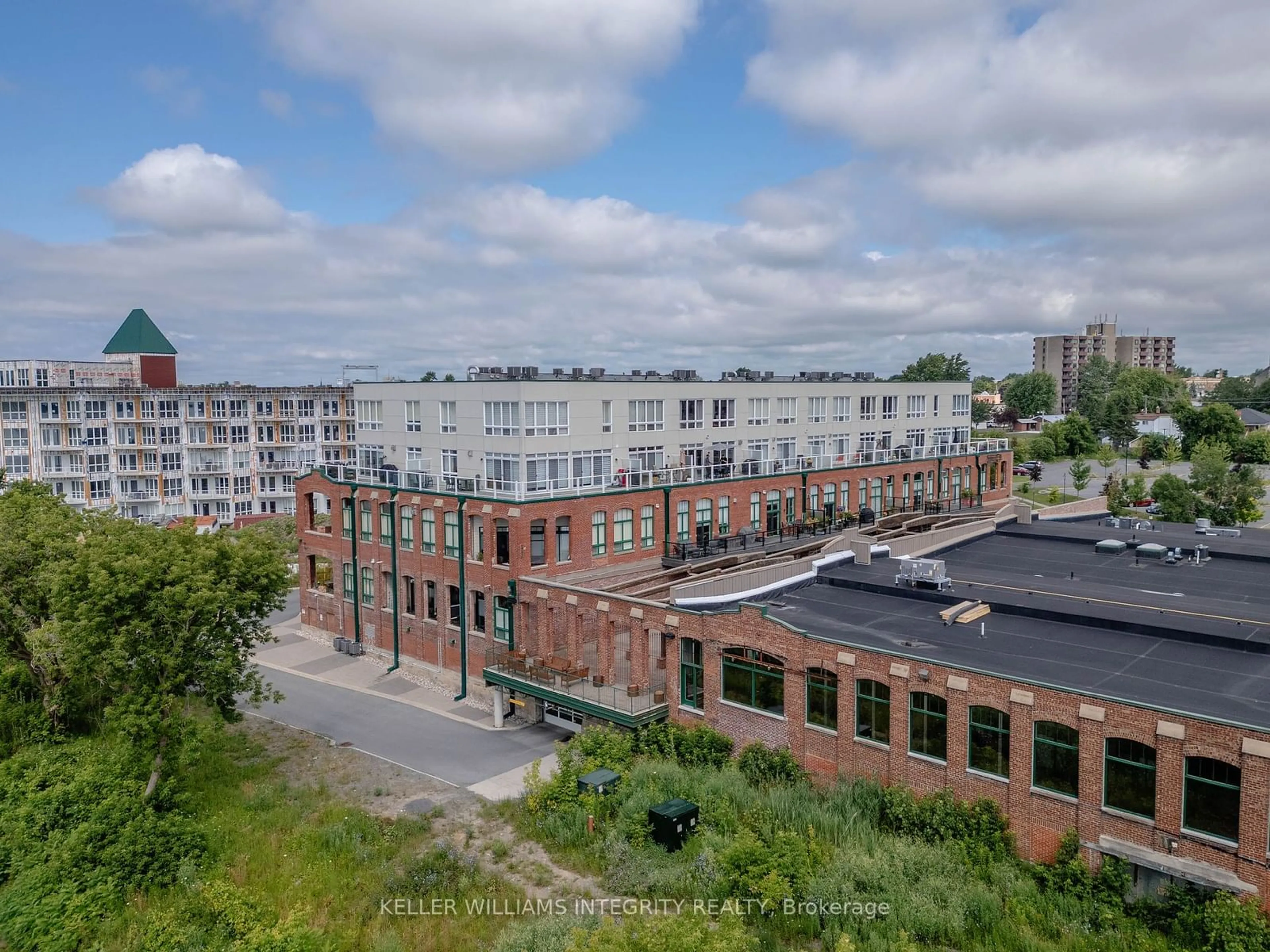 A pic from outside/outdoor area/front of a property/back of a property/a pic from drone, city buildings view from balcony for 703 COTTON MILL St #305, Cornwall Ontario K6H 7K7