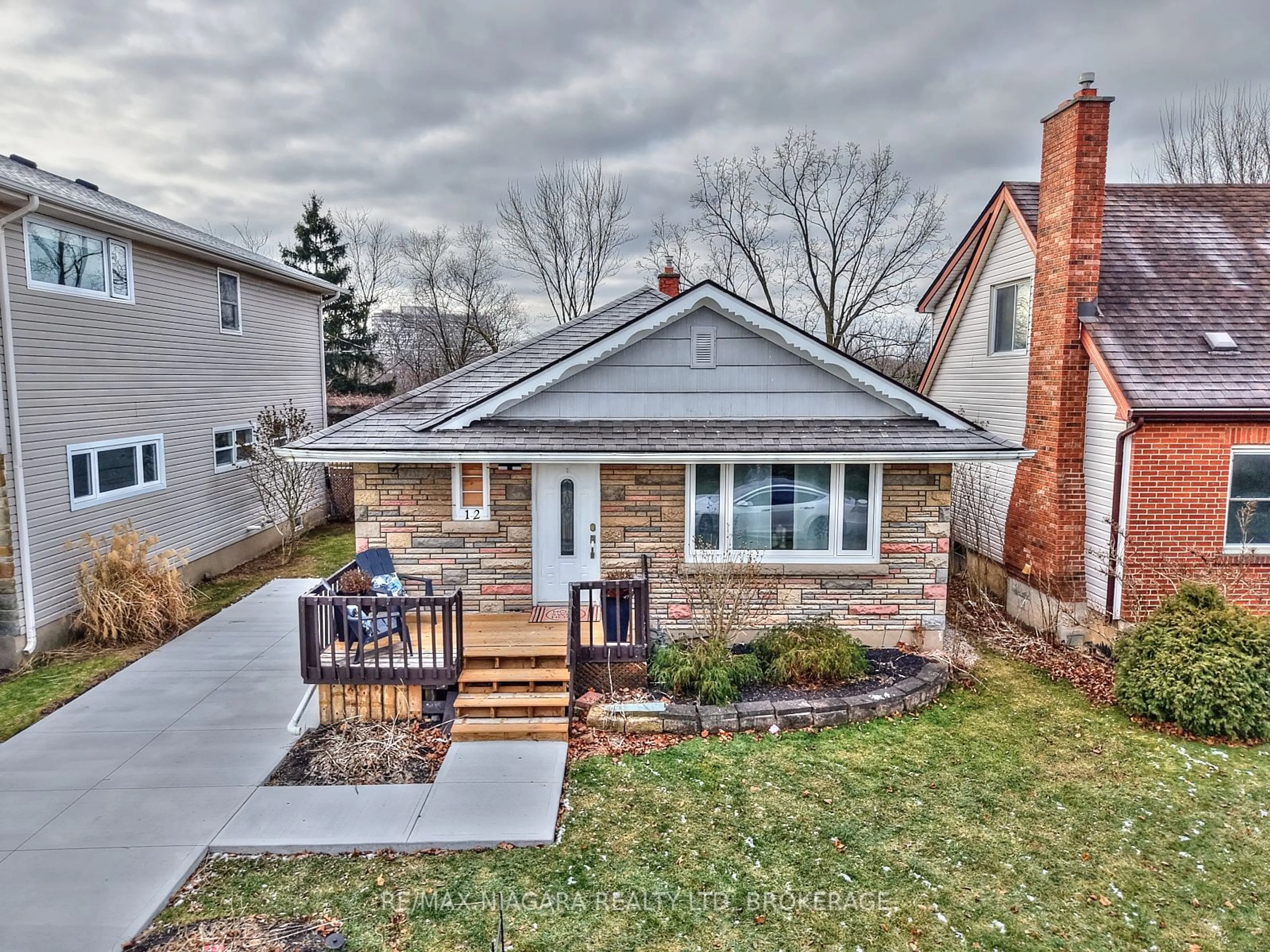 Home with brick exterior material, street for 12 Cliff Rd, St. Catharines Ontario L2R 3W1