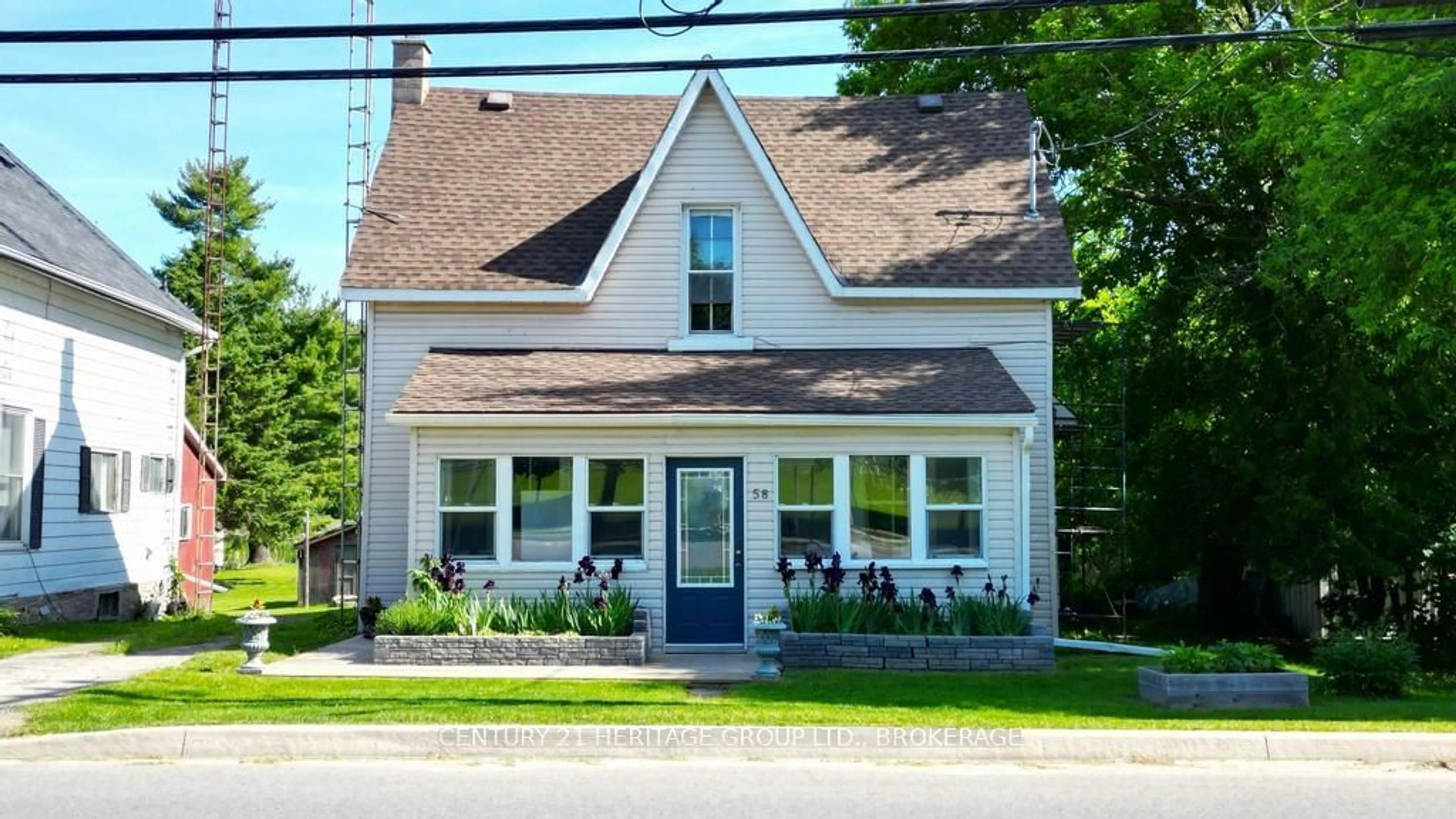 Home with vinyl exterior material, street for 58 Bedford St, Westport Ontario K0G 1X0