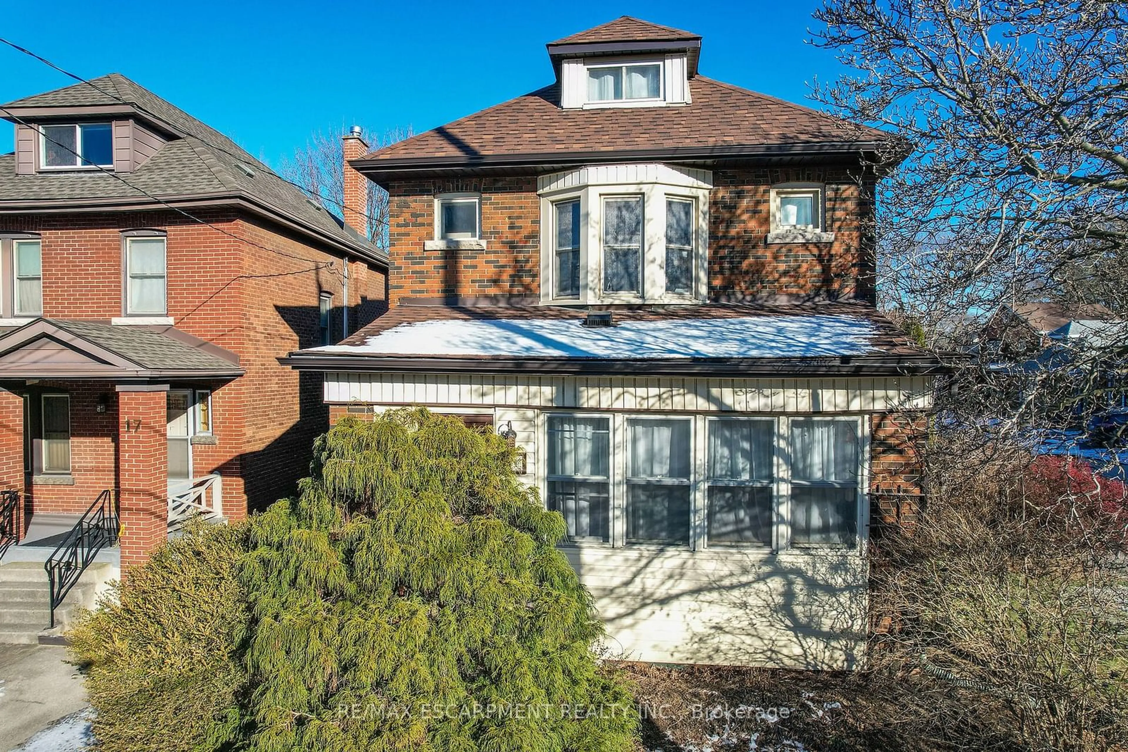 Home with brick exterior material, street for 21 Paisley Ave, Hamilton Ontario L8S 1T8