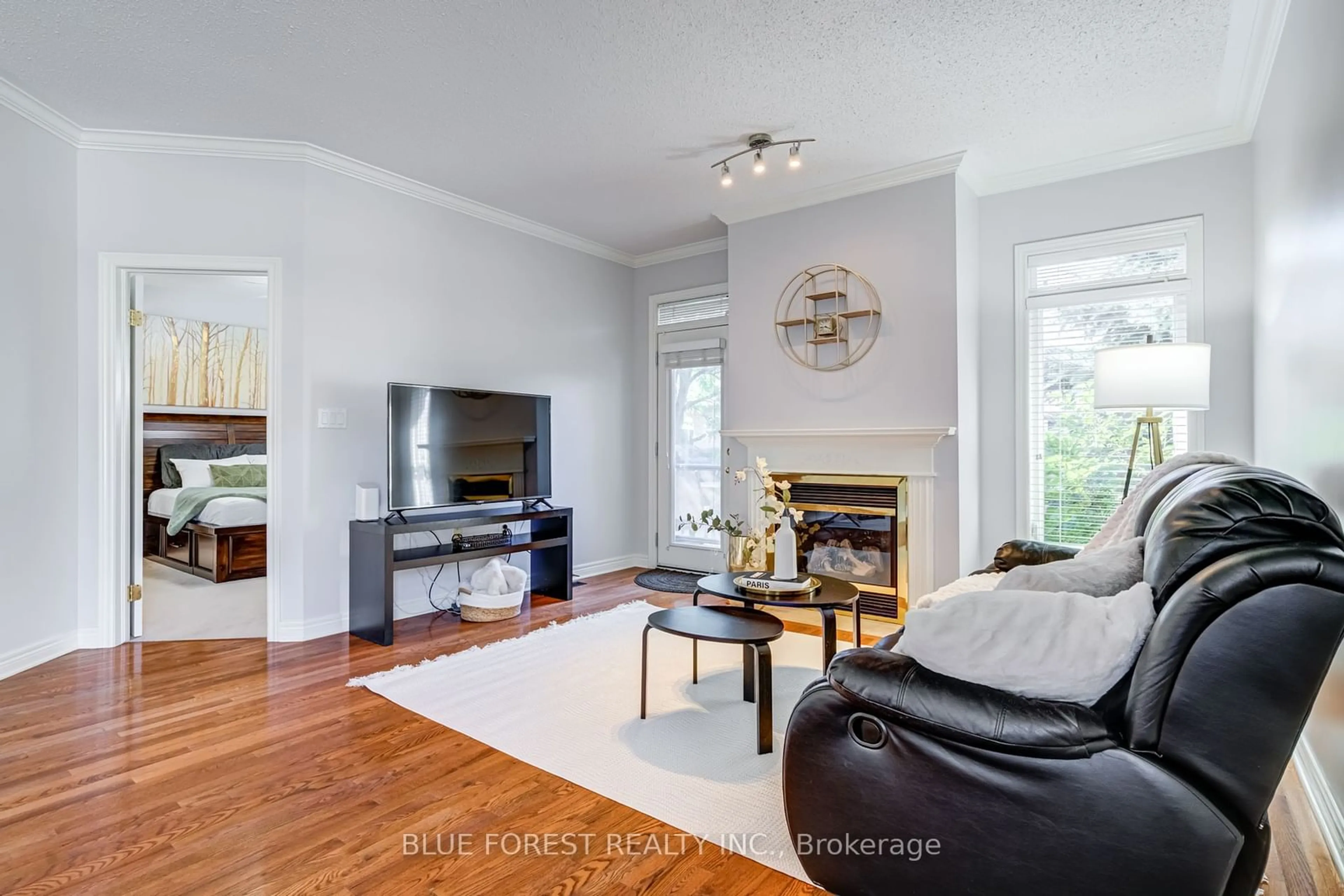 Living room with furniture, wood/laminate floor for 2025 Meadowgate Blvd #145, London Ontario N6M 1K9