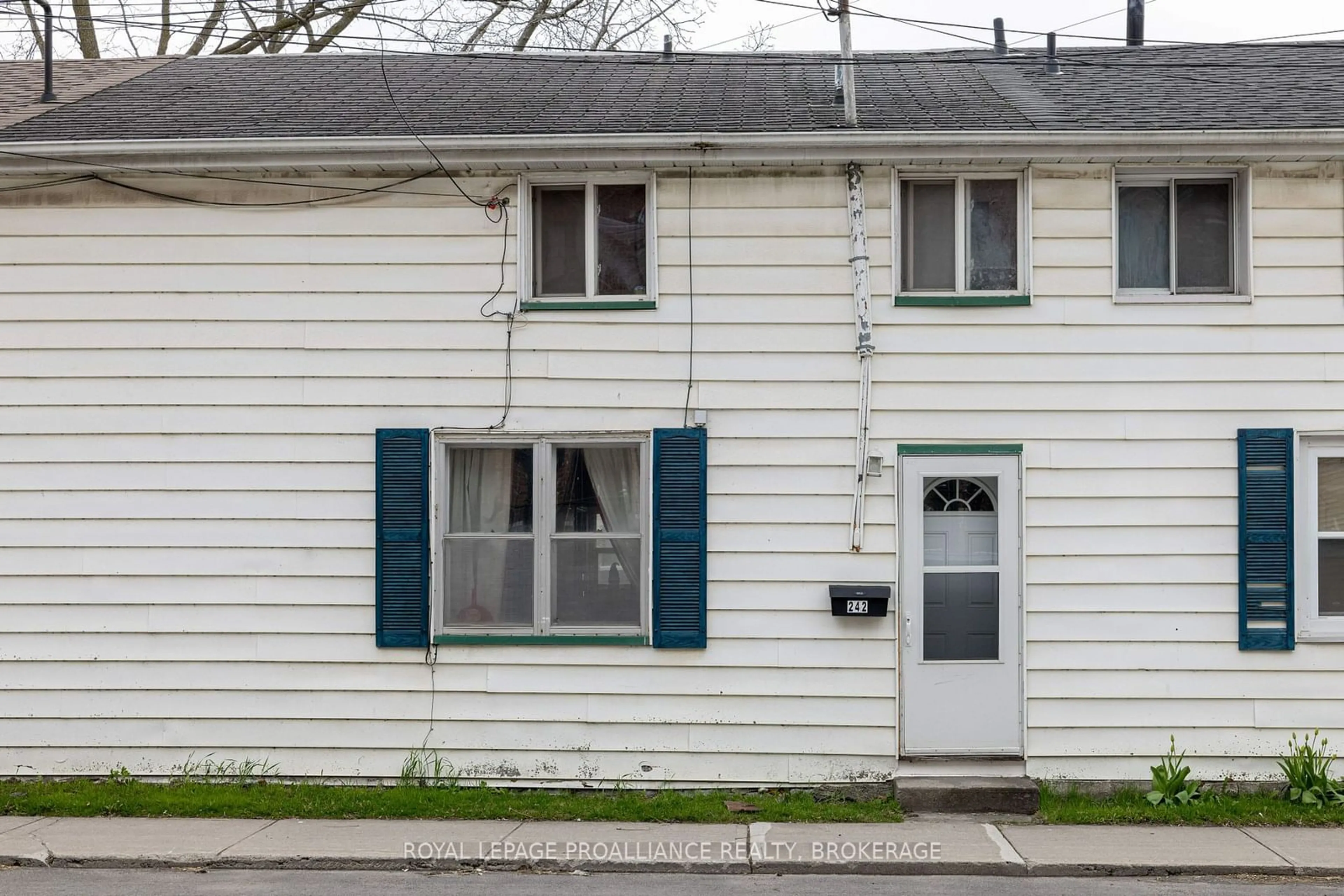 Home with vinyl exterior material, street for 242 Colborne St, Kingston Ontario K7K 1E3