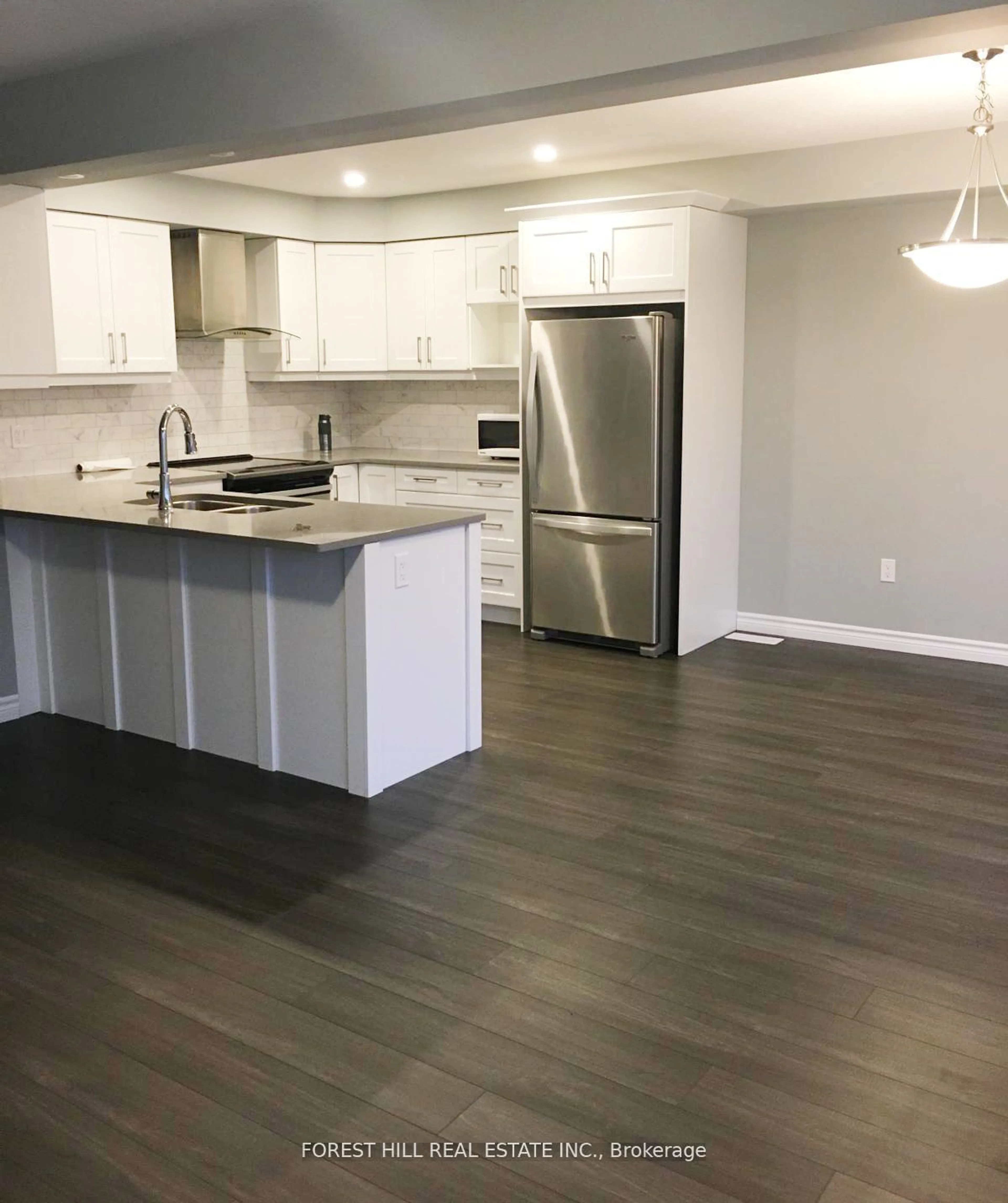 Open concept kitchen, wood/laminate floor for 1061 Eagletrace Dr #99, London Ontario N6G 0T3