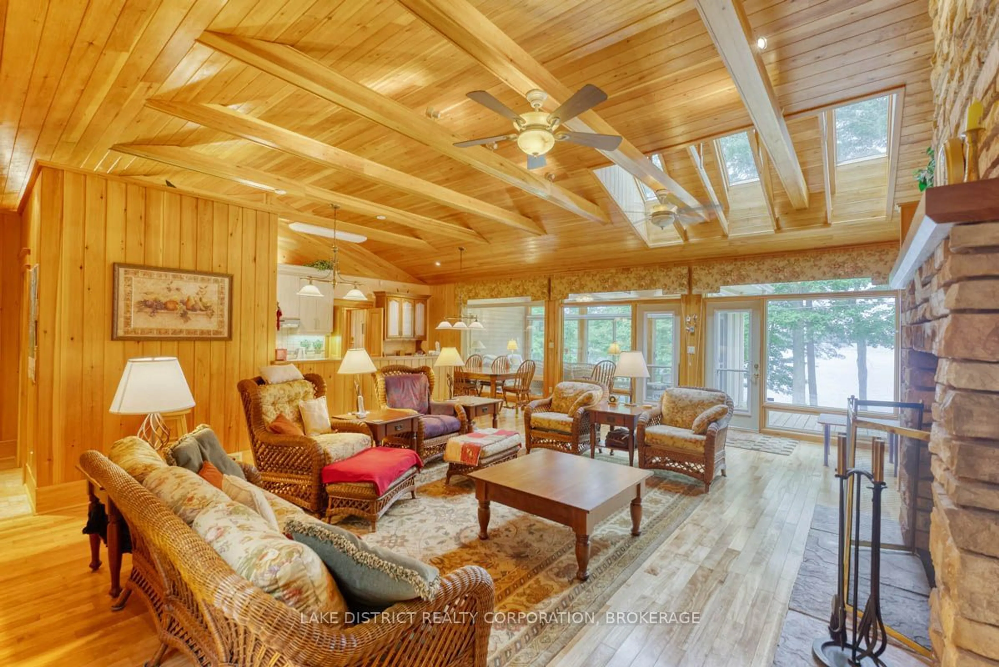 Living room with furniture, wood/laminate floor for 106 OAK HAVEN Lane, South Frontenac Ontario K0H 2V0