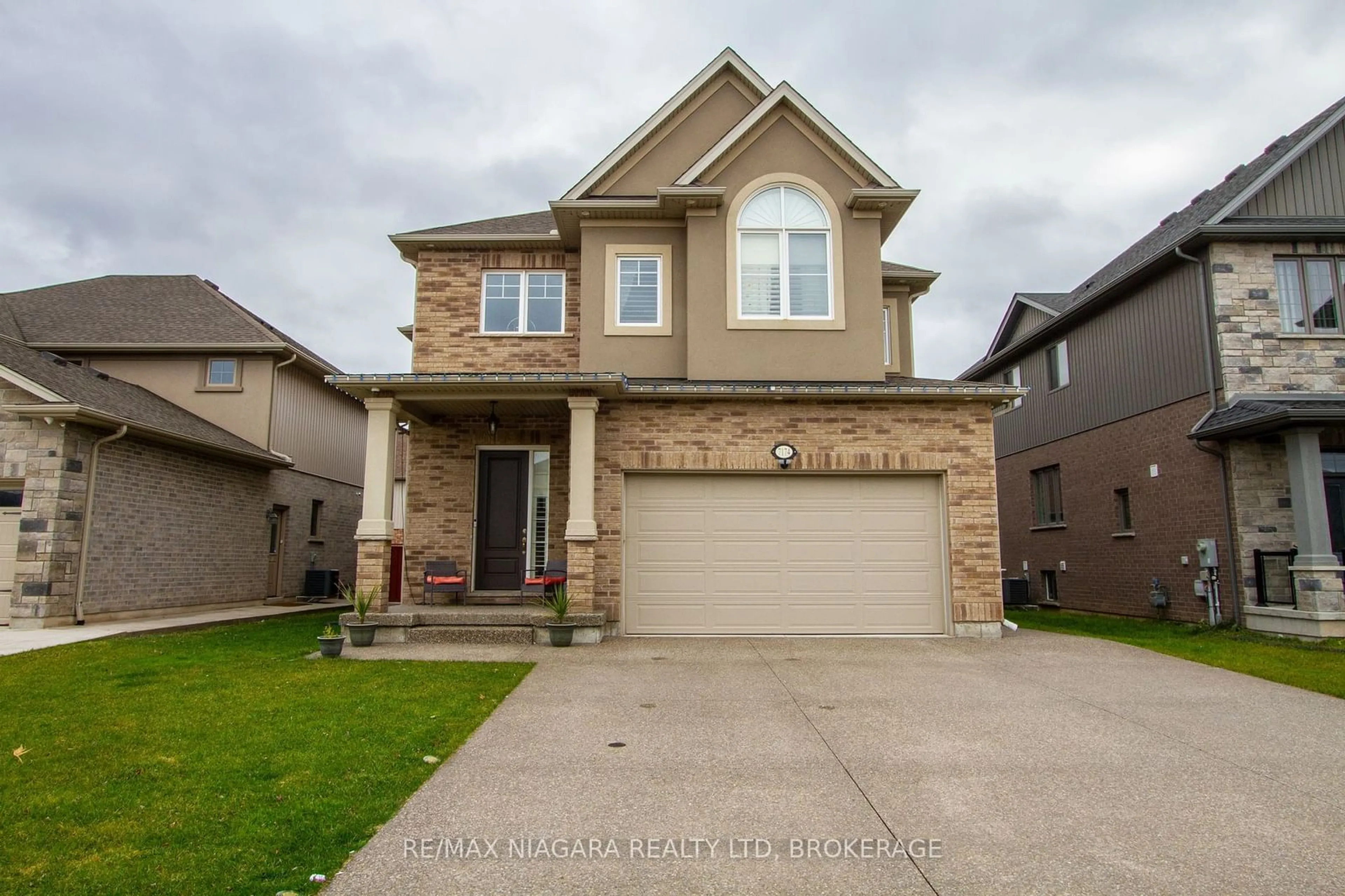 Home with brick exterior material, street for 7174 Optimist Lane, Niagara Falls Ontario L2E 0B2