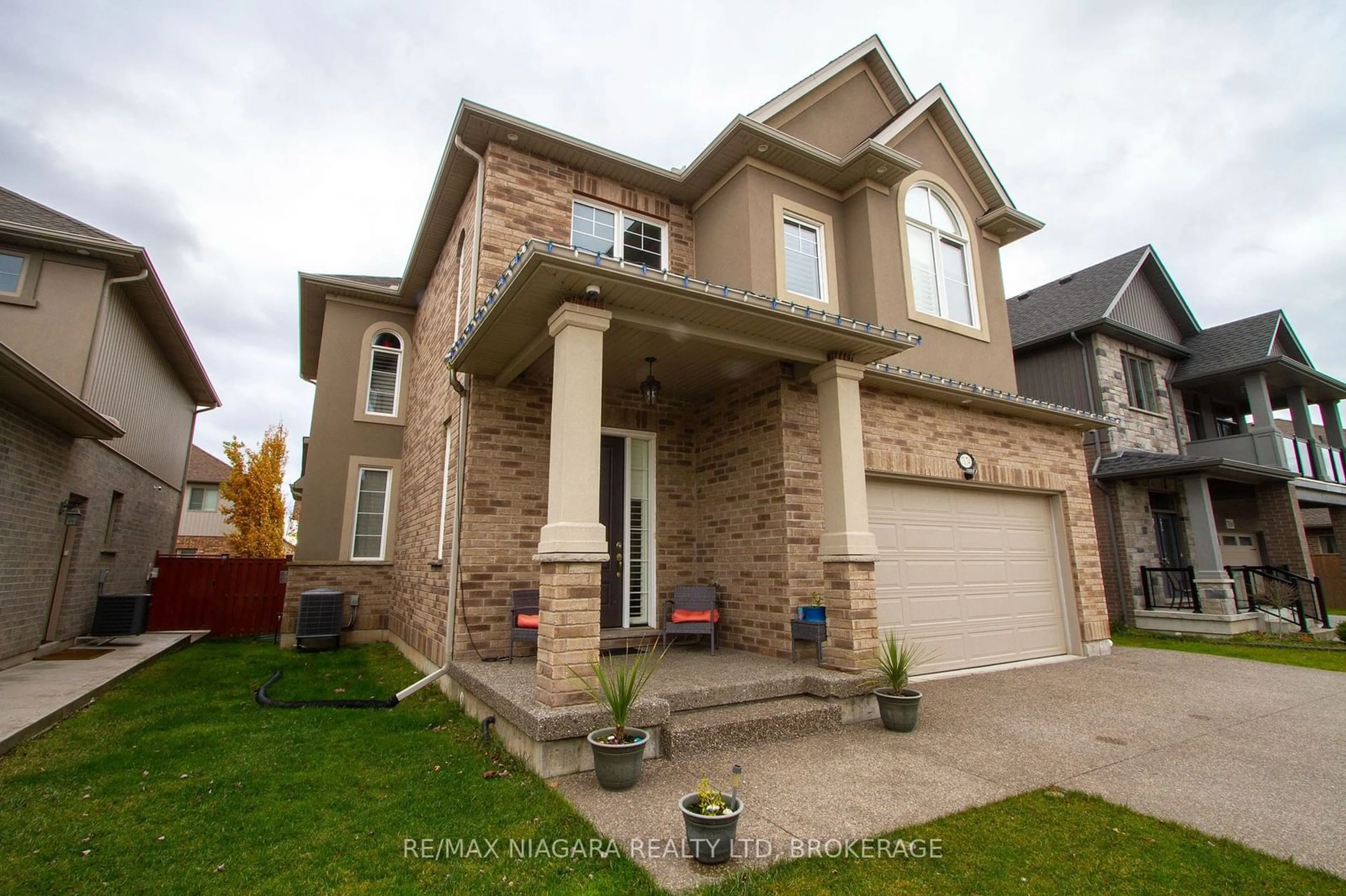 Home with brick exterior material, street for 7174 Optimist Lane, Niagara Falls Ontario L2E 0B2