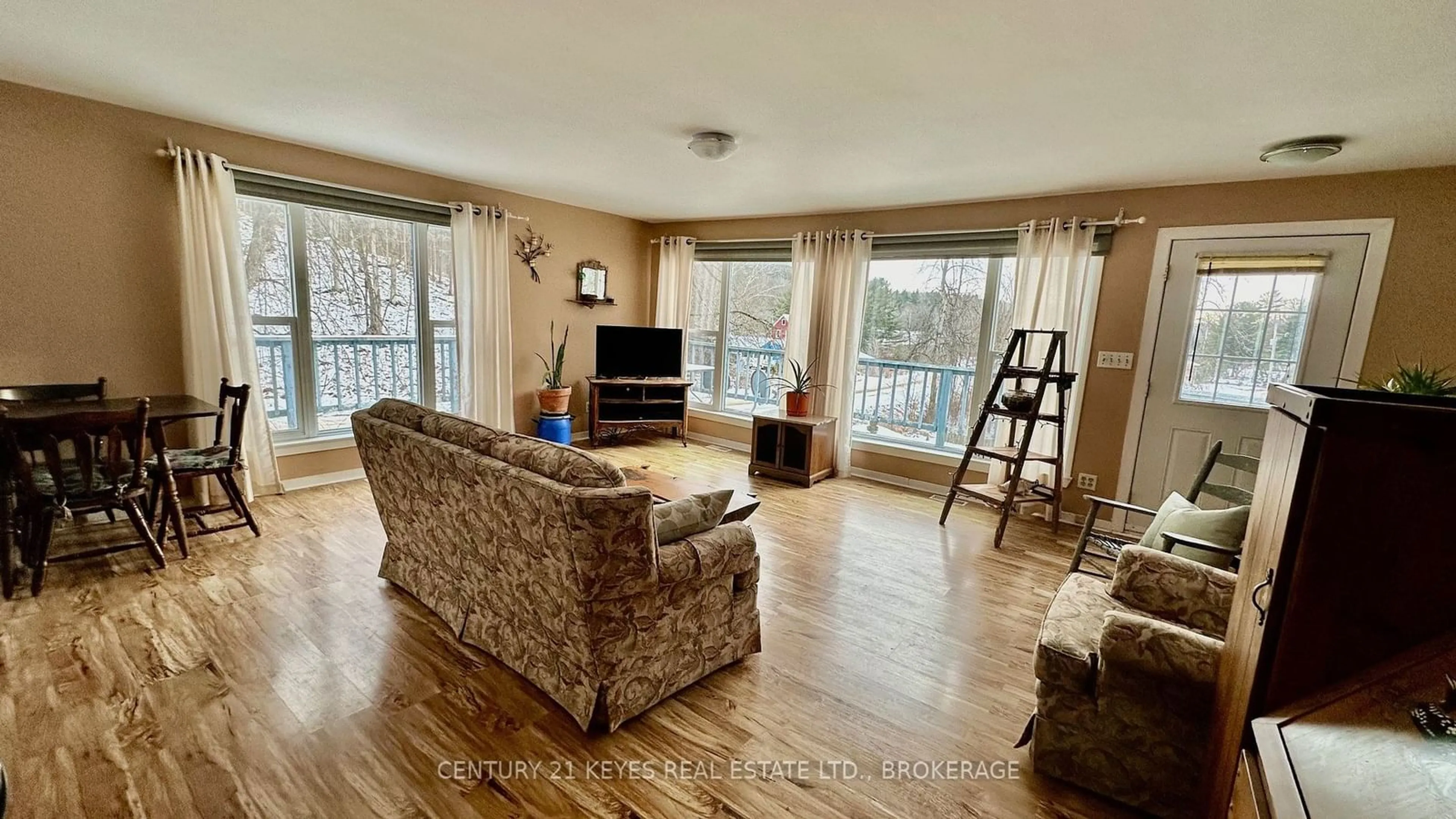 Living room with furniture, wood/laminate floor for 68 Gananoque Lake Rd, Leeds & Grenville Ontario K7G 2V4