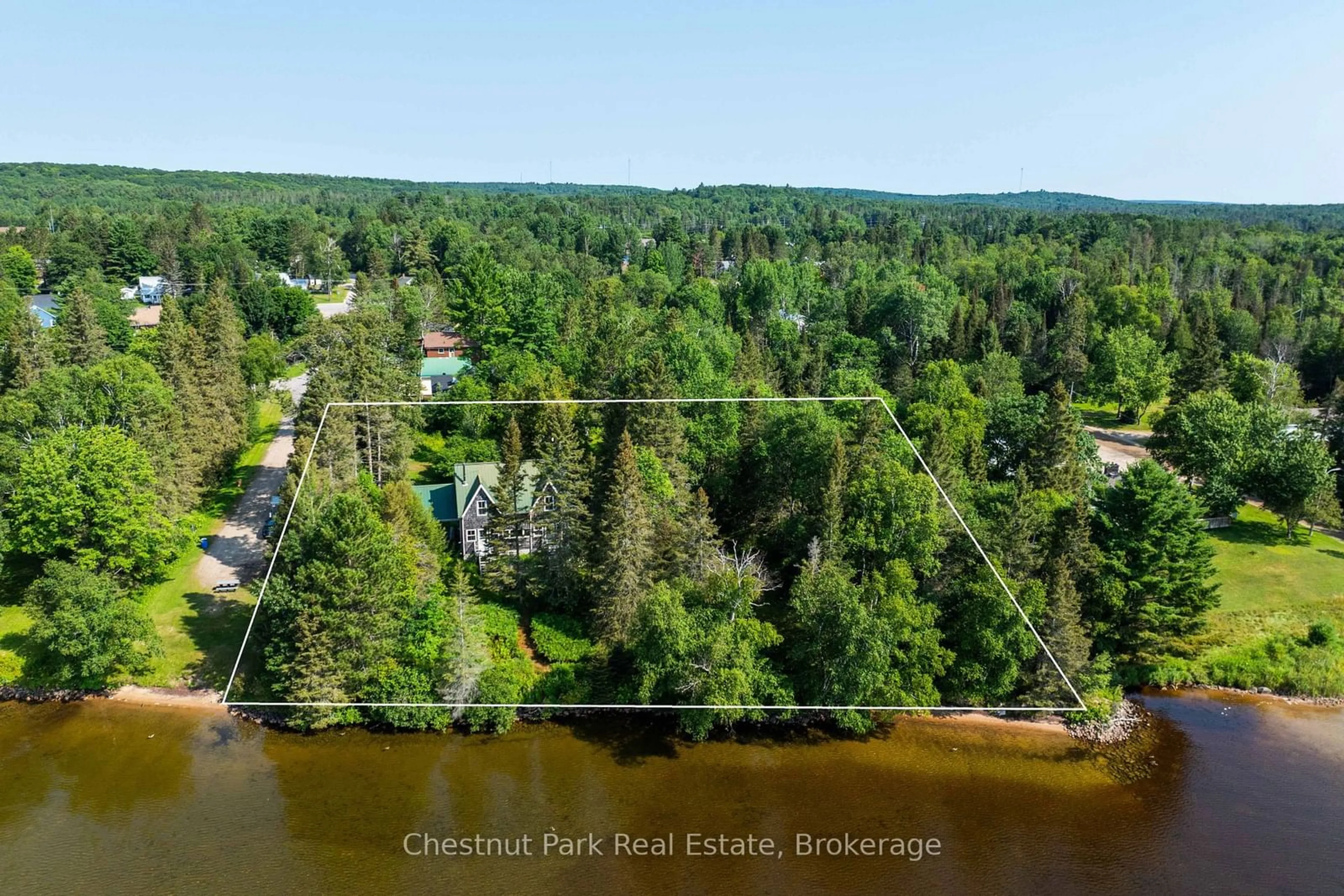 A pic from outside/outdoor area/front of a property/back of a property/a pic from drone, water/lake/river/ocean view for 1 & 5 Barrie St, Sundridge Ontario P0A 1Z0