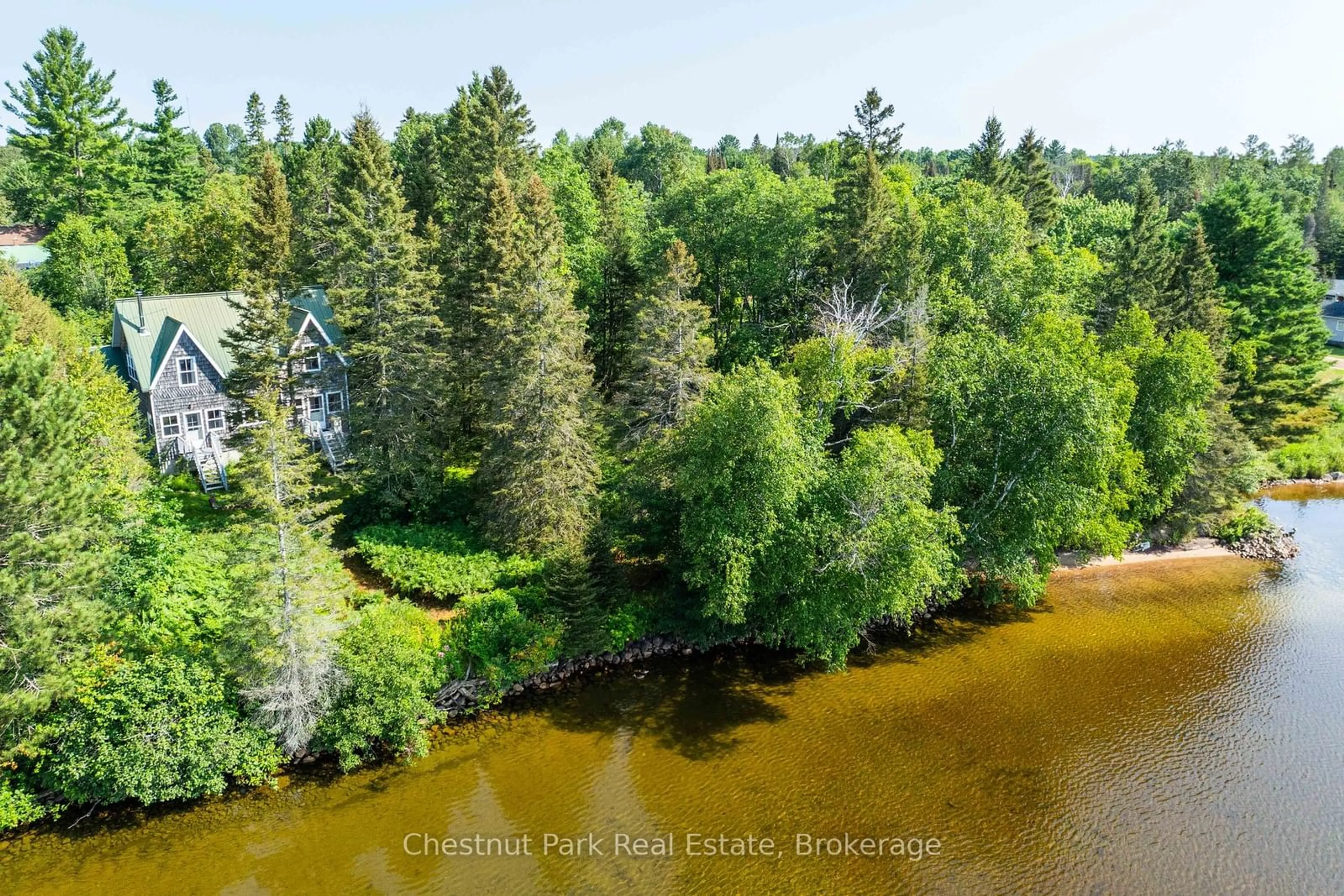 A pic from outside/outdoor area/front of a property/back of a property/a pic from drone, water/lake/river/ocean view for 1 & 5 Barrie St, Sundridge Ontario P0A 1Z0