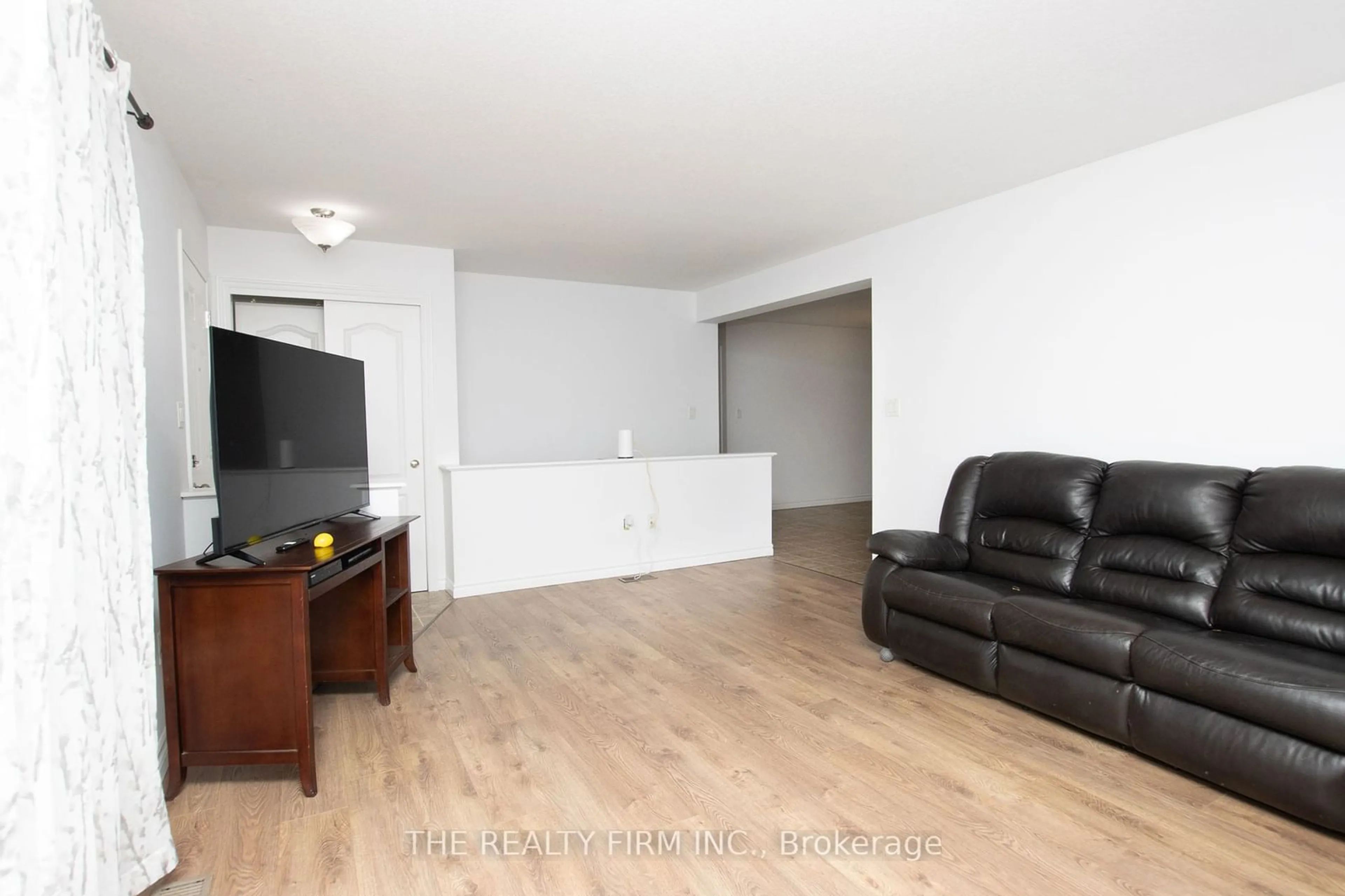 Living room with furniture, wood/laminate floor for 141 Cambridge St, Goderich Ontario N7A 2Y5