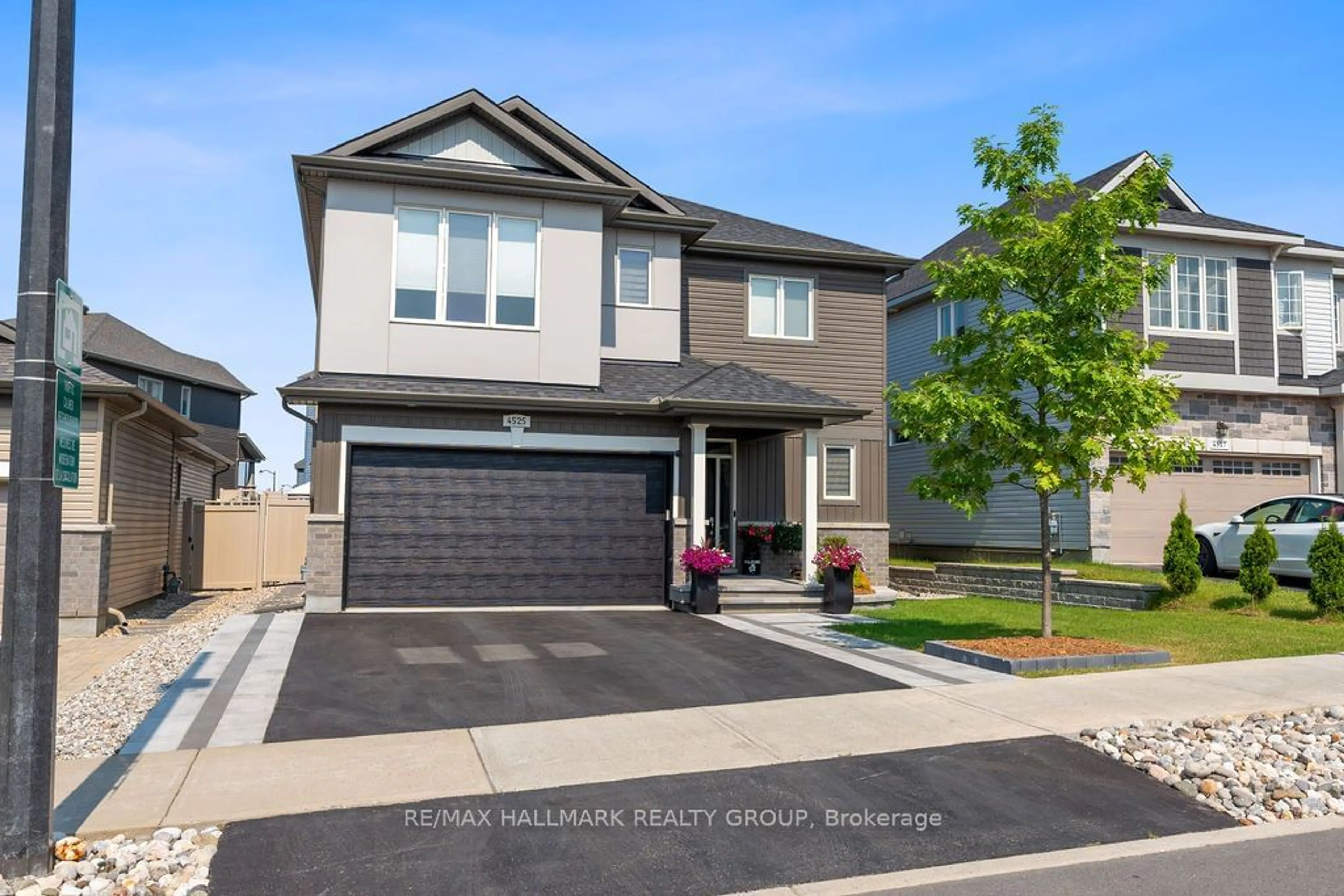 Home with vinyl exterior material, street for 4525 Kelly Farm Dr, Blossom Park - Airport and Area Ontario K1X 0E7