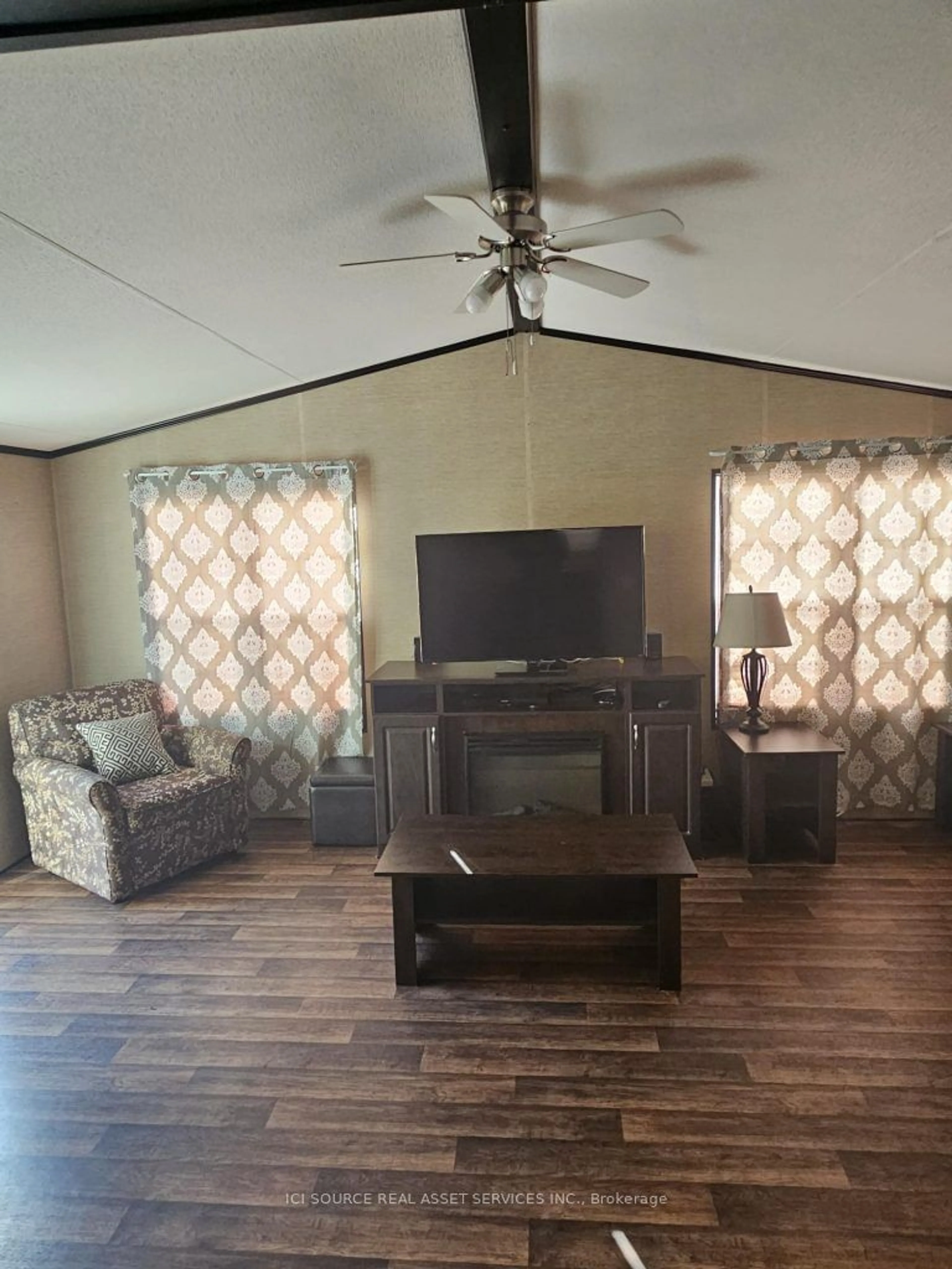 Living room with furniture, wood/laminate floor for 1235 Villiers Line #FOR081, Otonabee-South Monaghan Ontario K0L 2G0