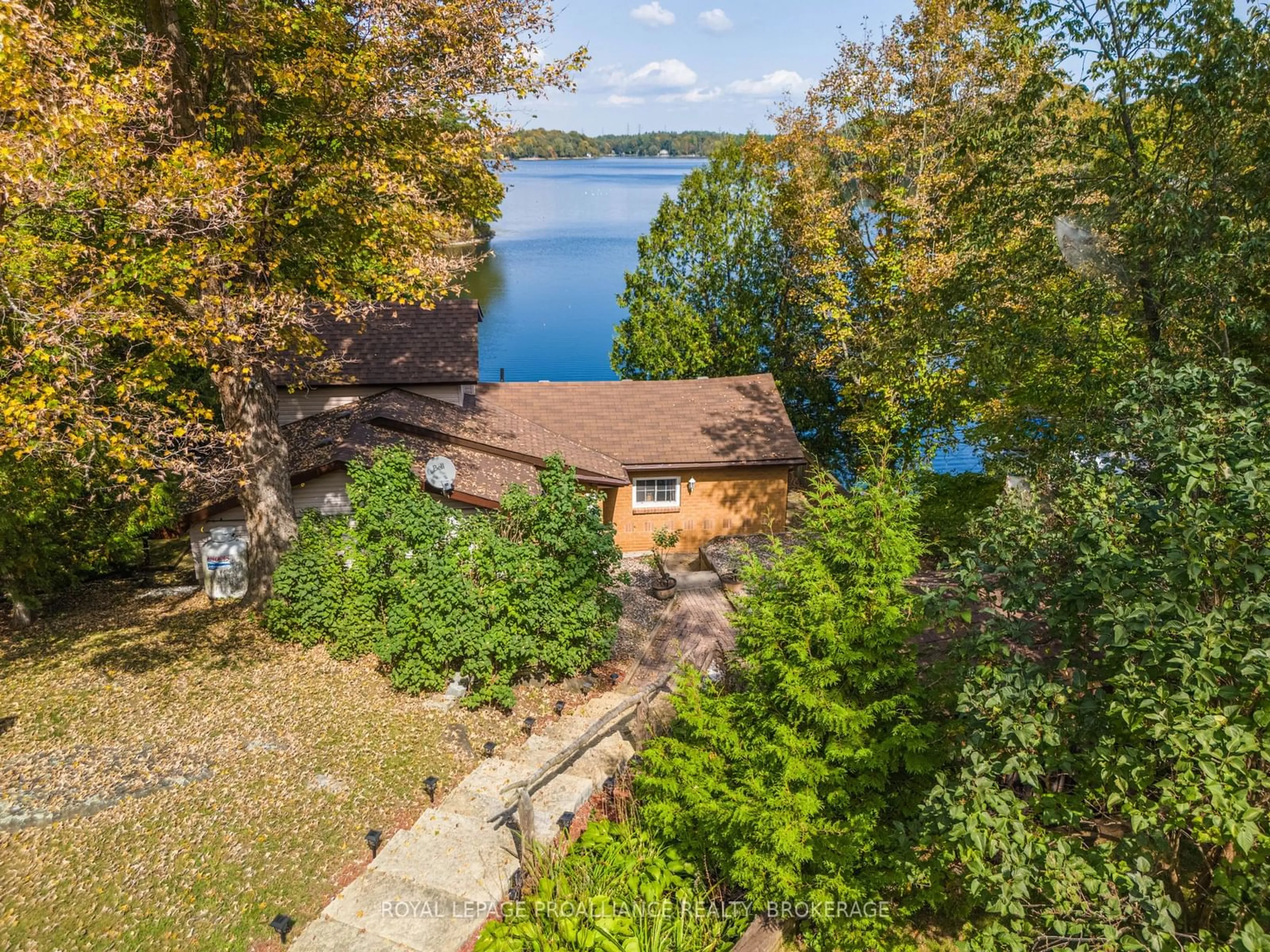 A pic from outside/outdoor area/front of a property/back of a property/a pic from drone, water/lake/river/ocean view for 1057 Quinte Conservation Lane, South Frontenac Ontario K0H 2W0