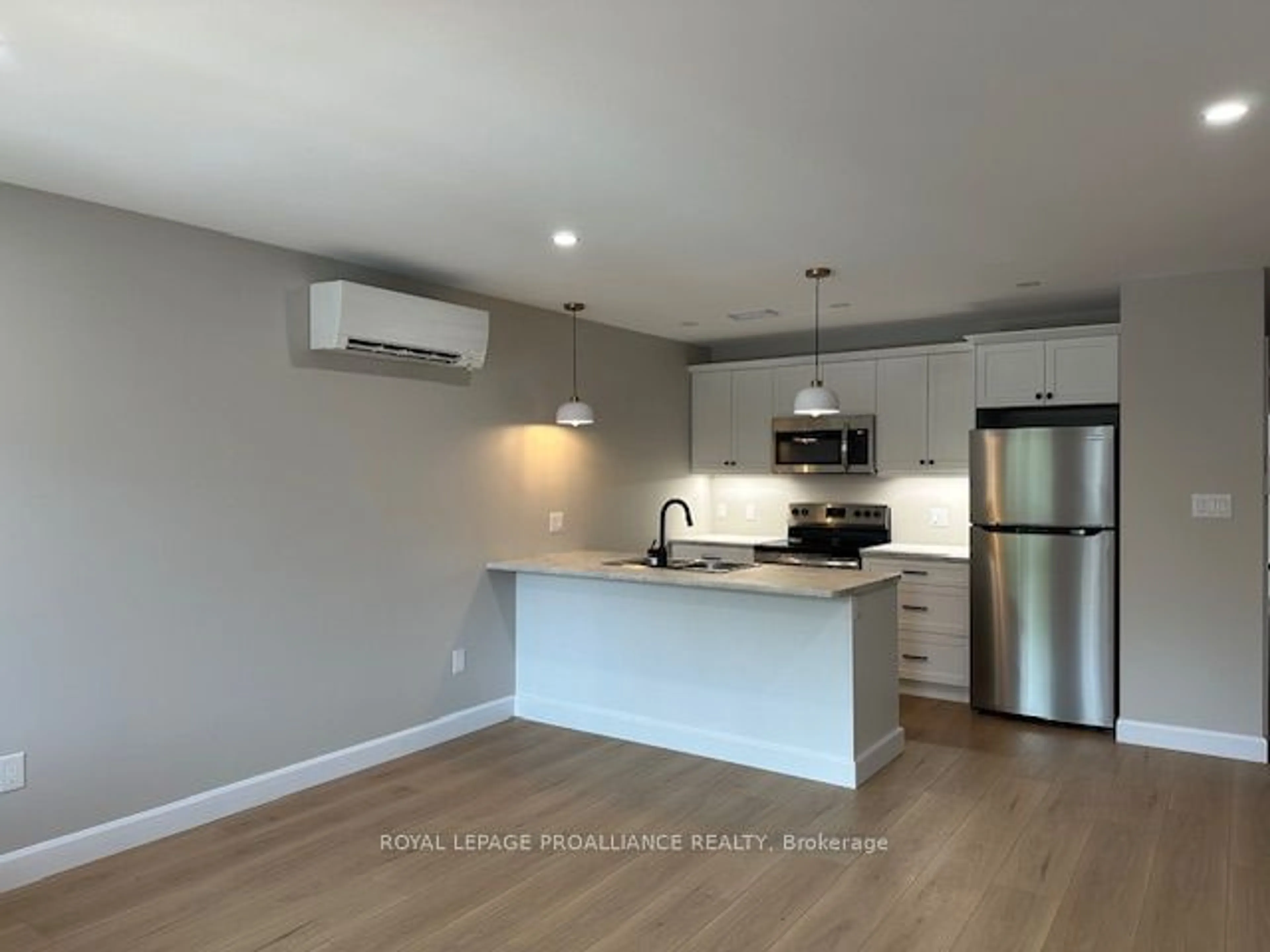 Open concept kitchen, wood/laminate floor for 83 BRIDGE St, Belleville Ontario K8P 1J4