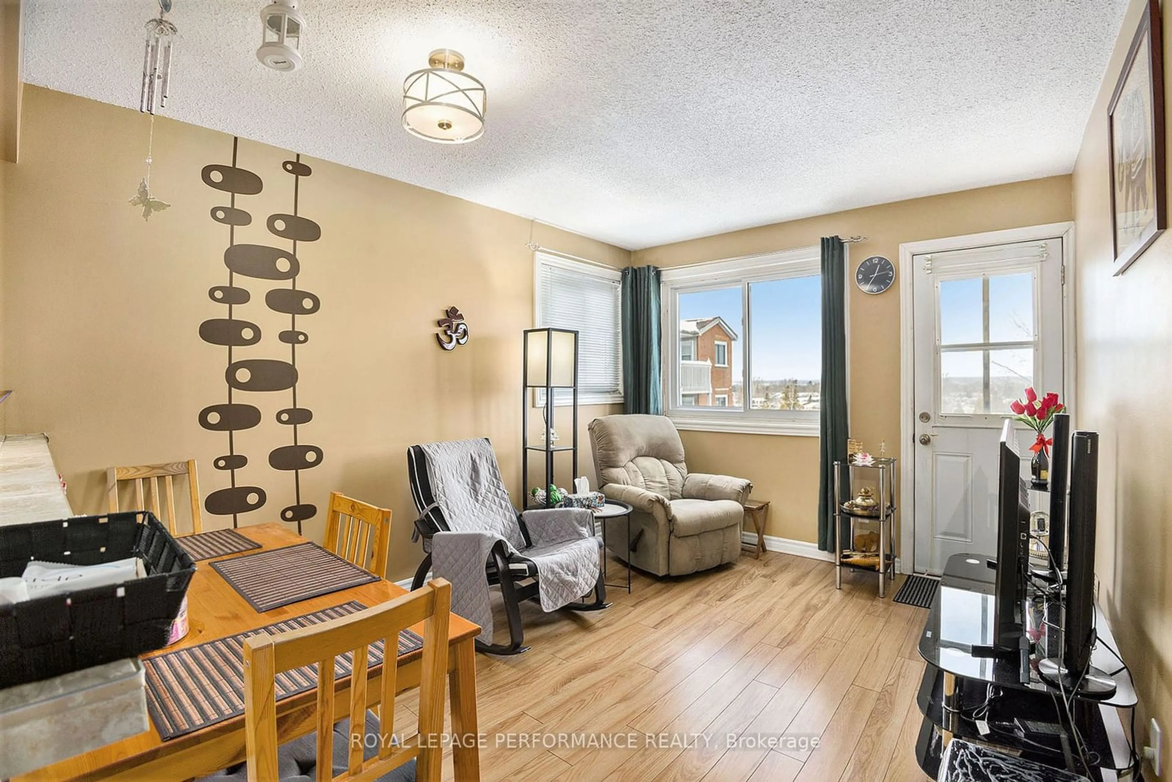 Living room with furniture, wood/laminate floor for 345 Centrum Blvd #308, Orleans - Cumberland and Area Ontario K1E 3W9