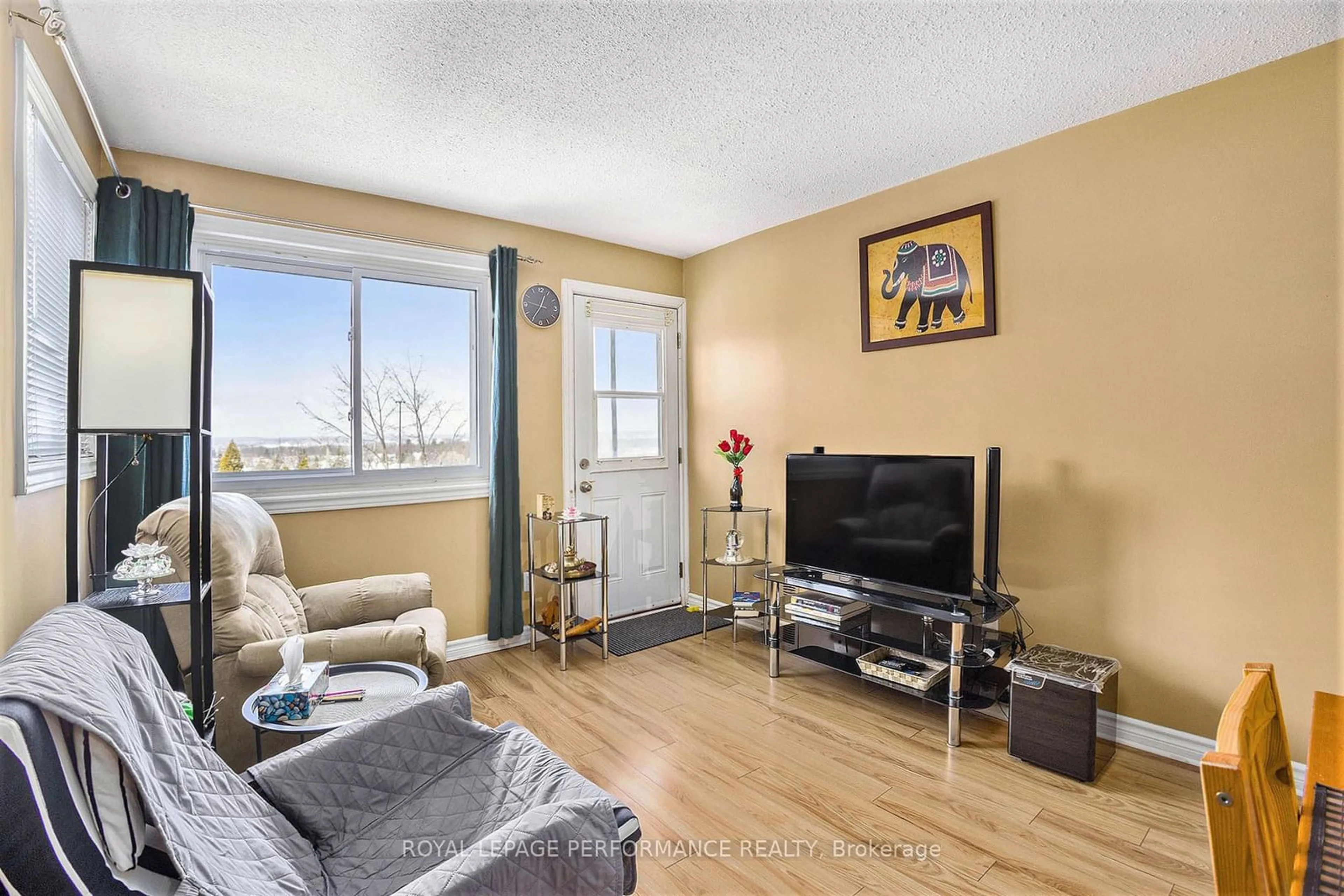 Living room with furniture, wood/laminate floor for 345 Centrum Blvd #308, Orleans - Cumberland and Area Ontario K1E 3W9