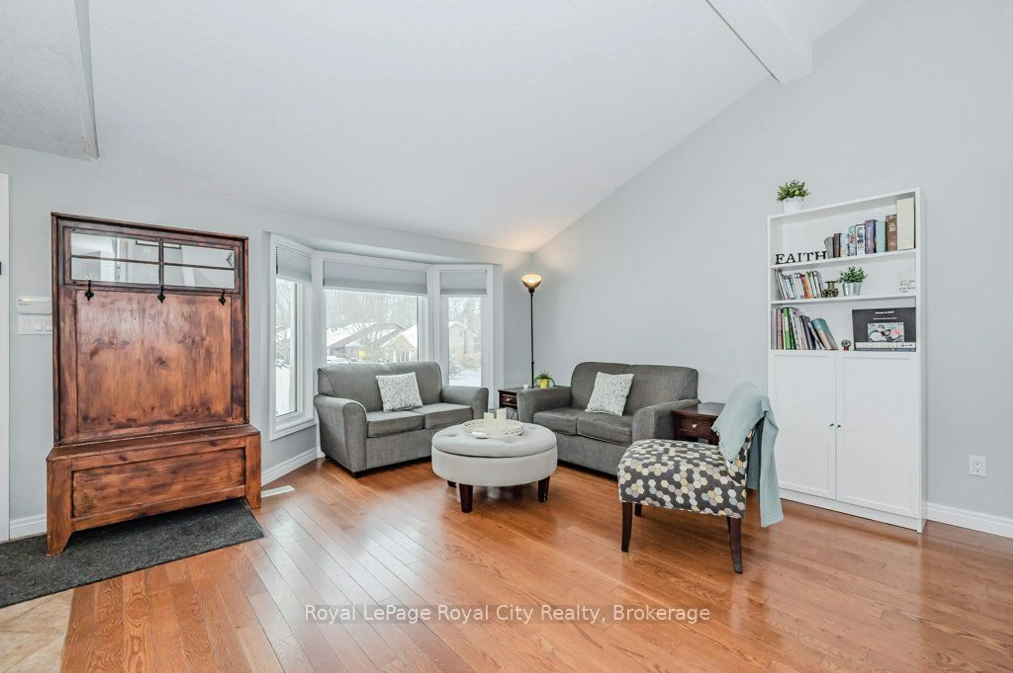 Living room with furniture, wood/laminate floor for 14 Primrose Lane, Guelph Ontario N1H 7V4