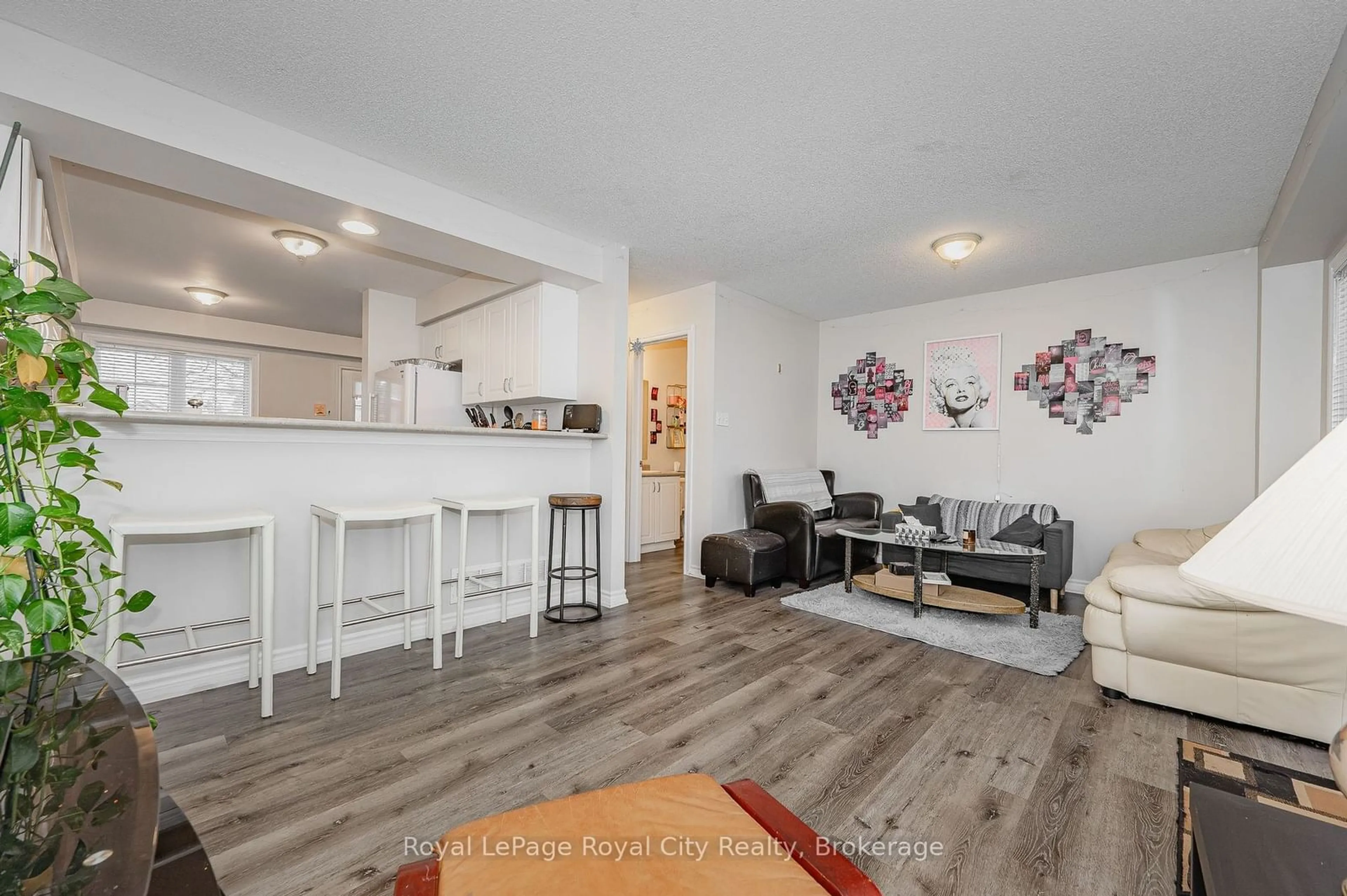 Open concept kitchen, wood/laminate floor for 1417 Gordon St #17, Guelph Ontario N1L 0B8