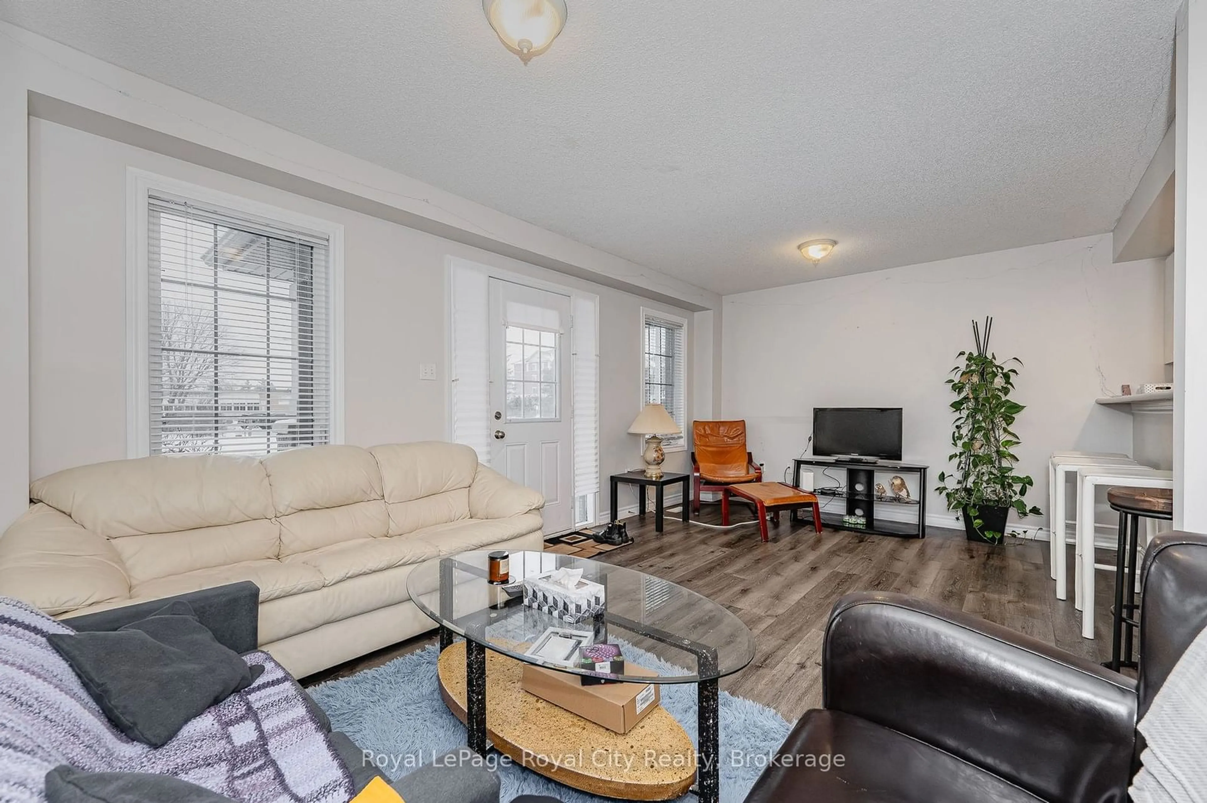 Living room with furniture, wood/laminate floor for 1417 Gordon St #17, Guelph Ontario N1L 0B8