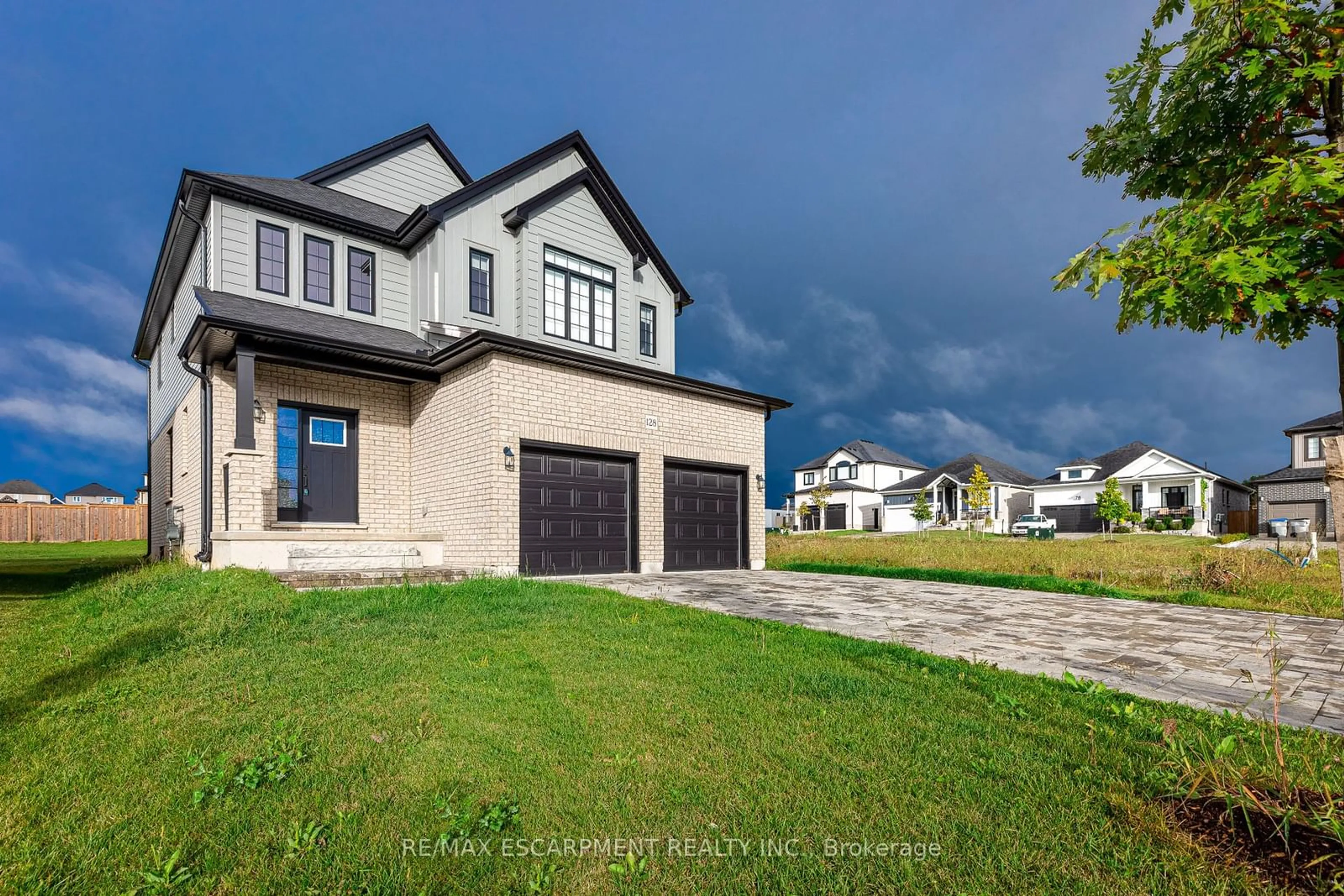 Home with vinyl exterior material, street for 128 Basil Cres, Middlesex Centre Ontario N0M 2A0