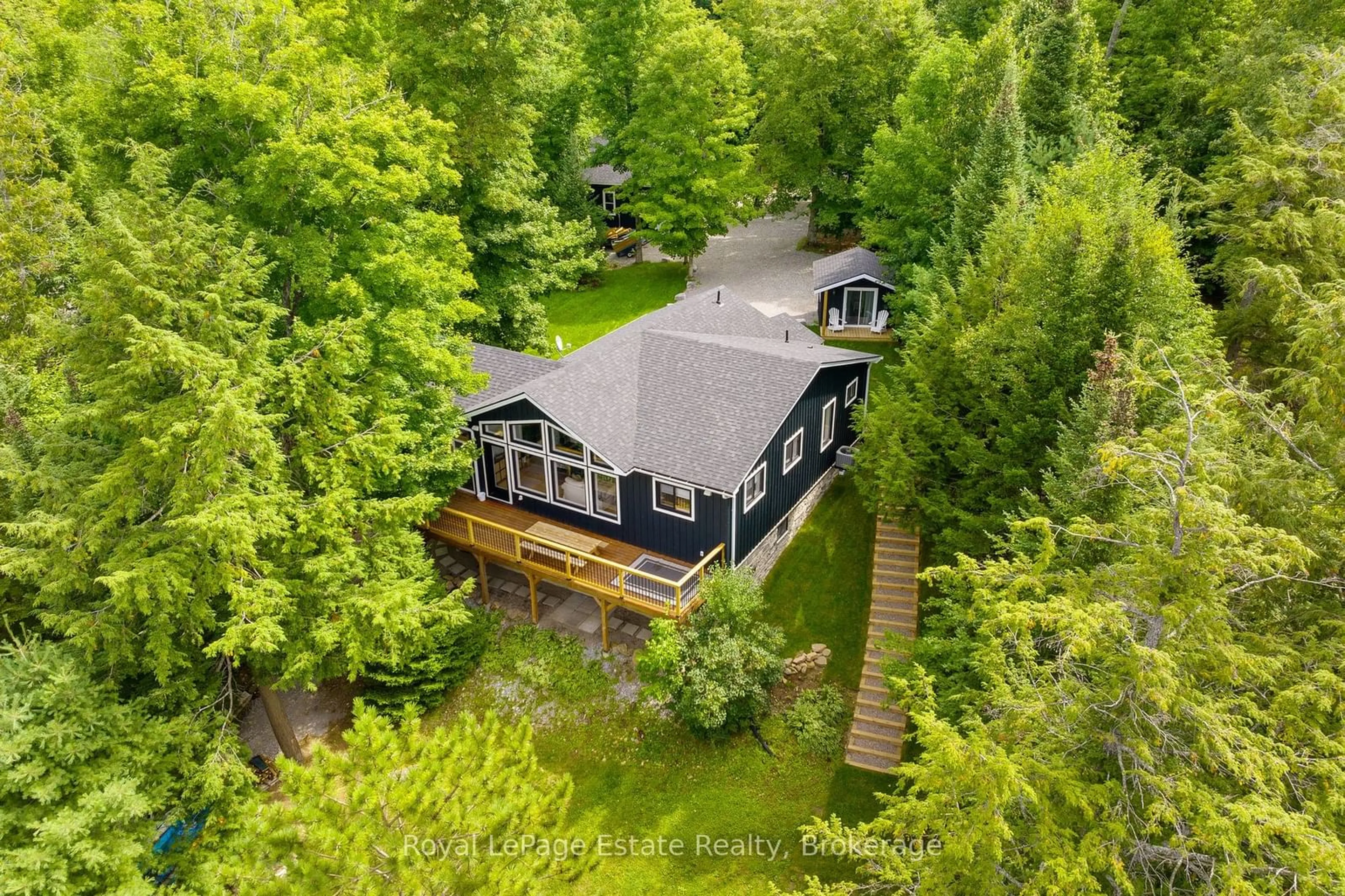 A pic from outside/outdoor area/front of a property/back of a property/a pic from drone, forest/trees view for 1083 Surf Tr, Minden Hills Ontario K0M 2K0