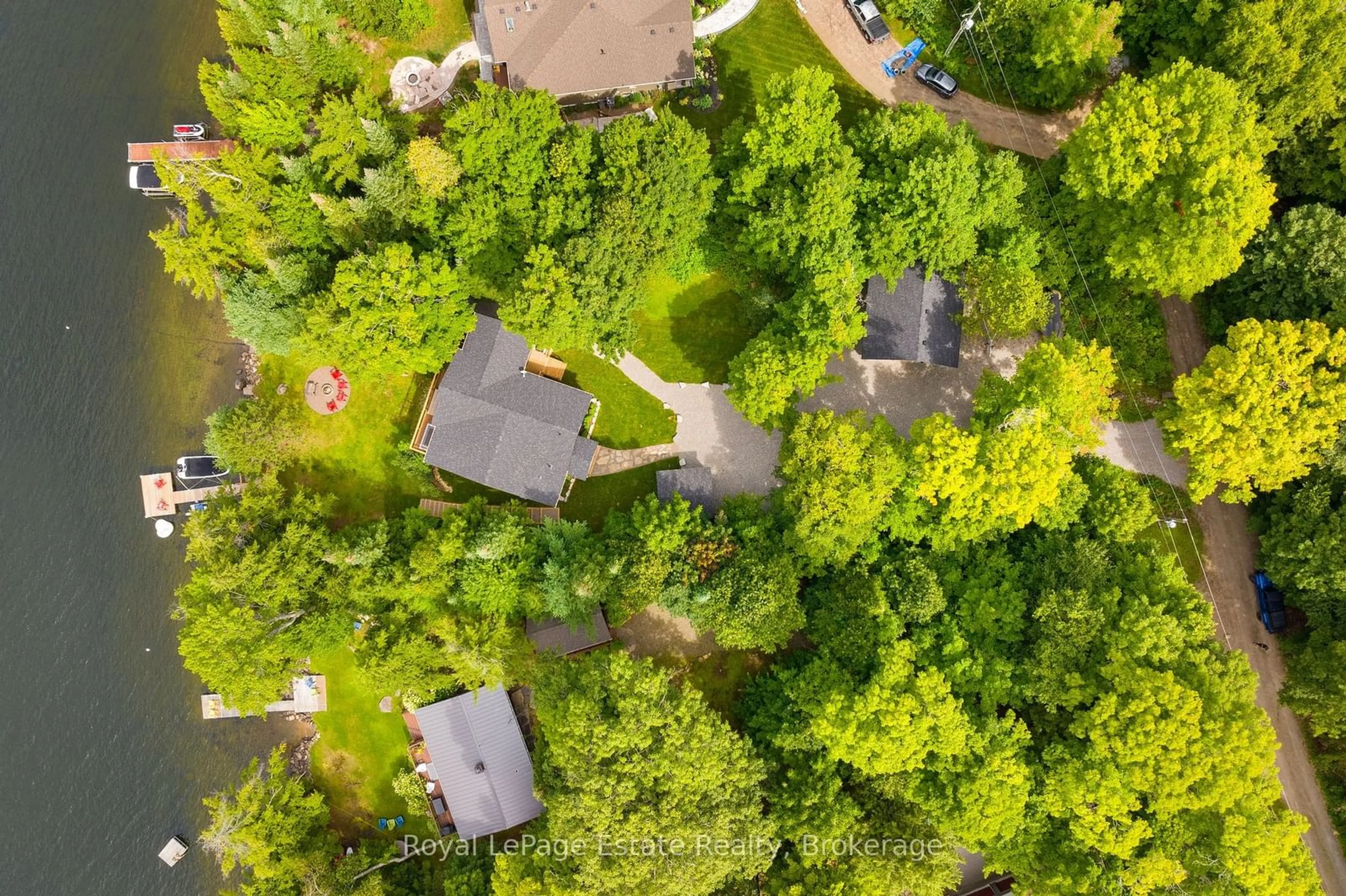 A pic from outside/outdoor area/front of a property/back of a property/a pic from drone, forest/trees view for 1083 Surf Tr, Minden Hills Ontario K0M 2K0